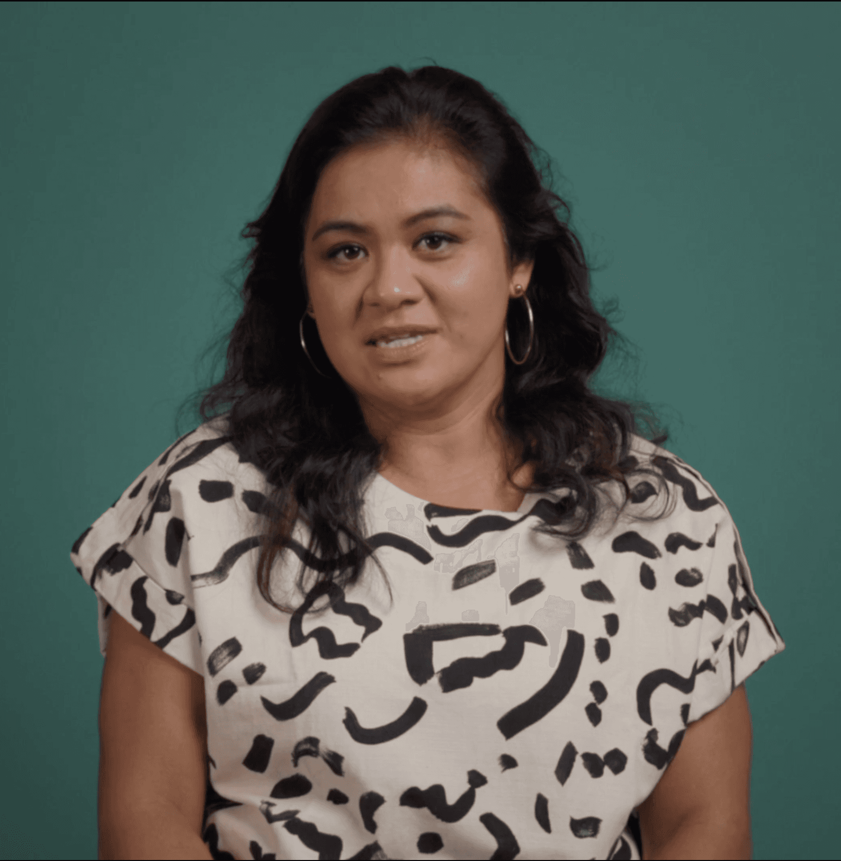 woman standing near blue steel gate
