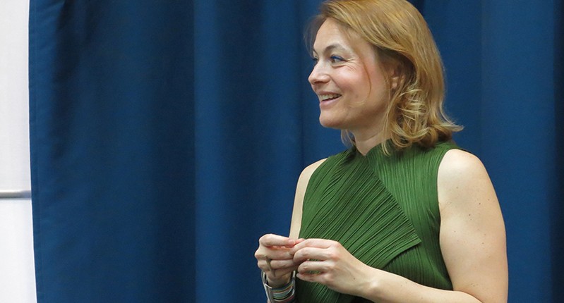 woman with a green sleeveless top