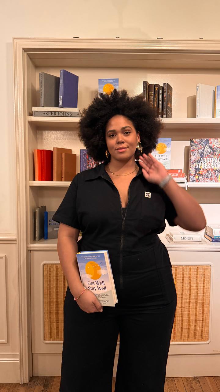 Shareefa J speaking in BuzzFeed’s Shine for Diversity documentary, holding a book during filming
