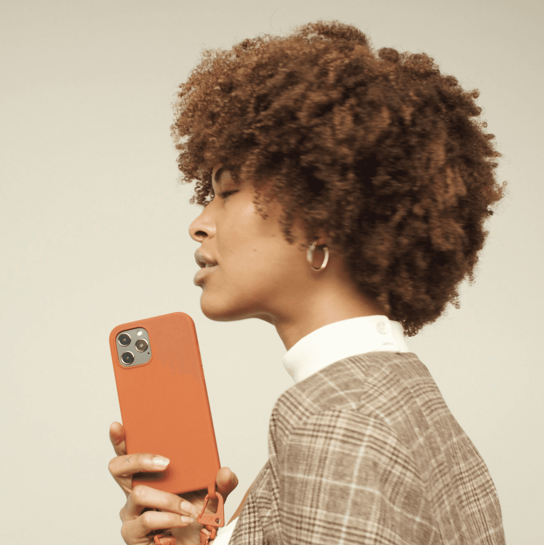 woman with orange phone case