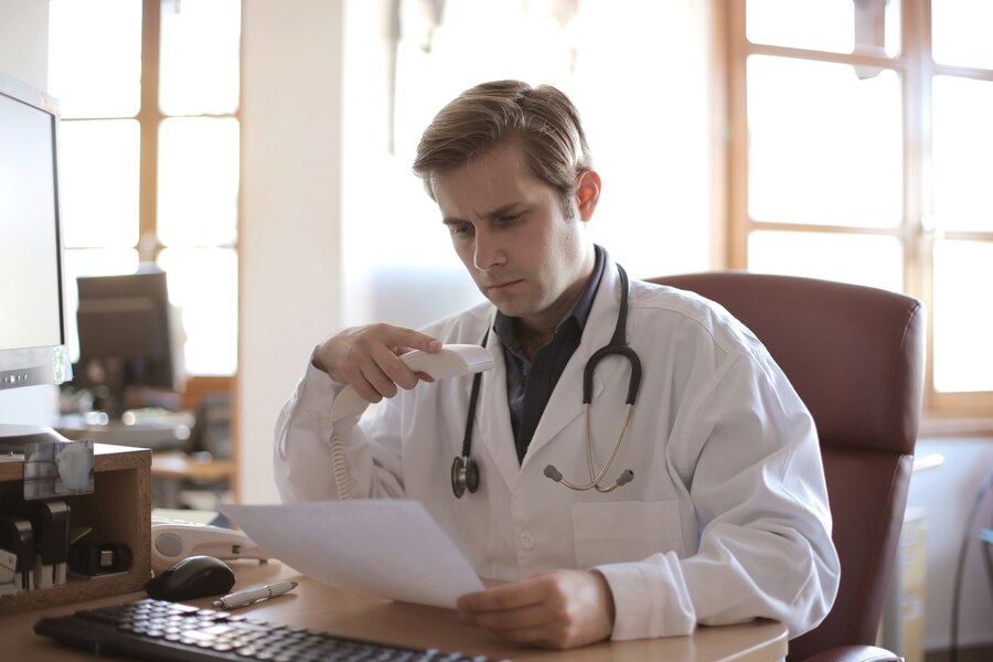 A doctor viewing his final reports.