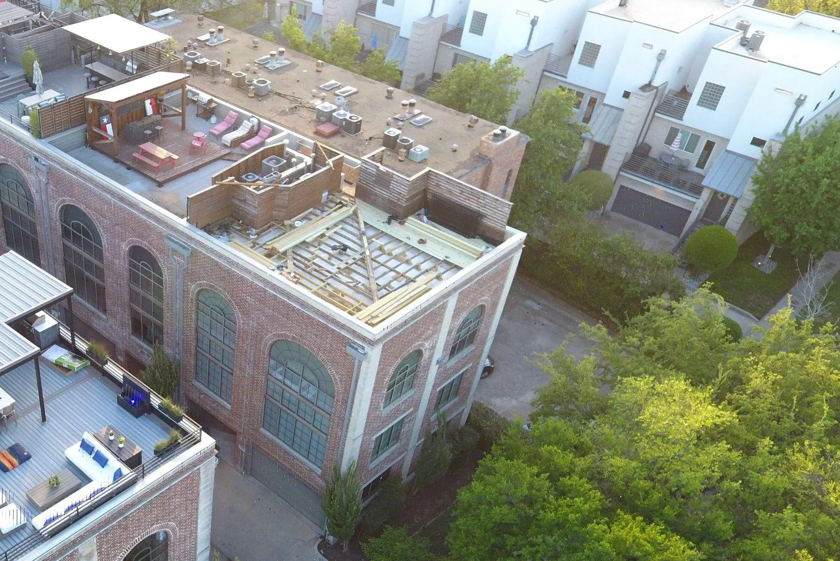 Aerial view of flat roof structure under construction on Oak Lawn residence in Dallas