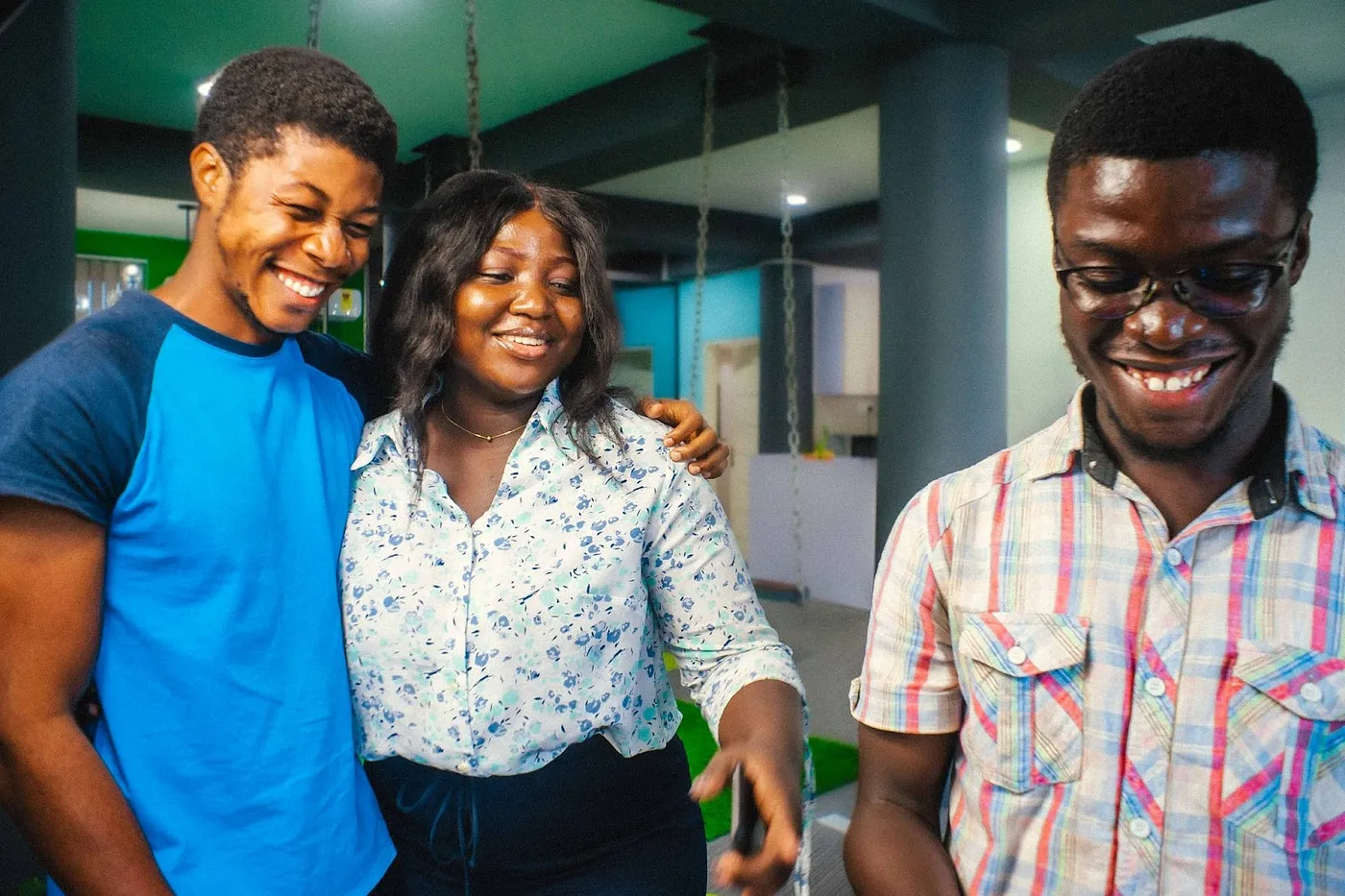 A black smartwatch with a colorful display resting on a white table, highlighting product design prototyping.