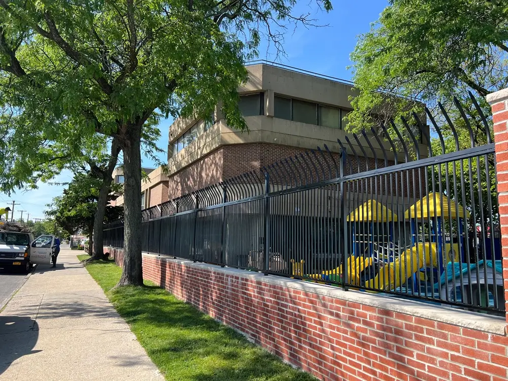 Custom brickwork with Capping Blue stone and custom iron fence for school completed by Jewel Construction in Brooklyn, NYC