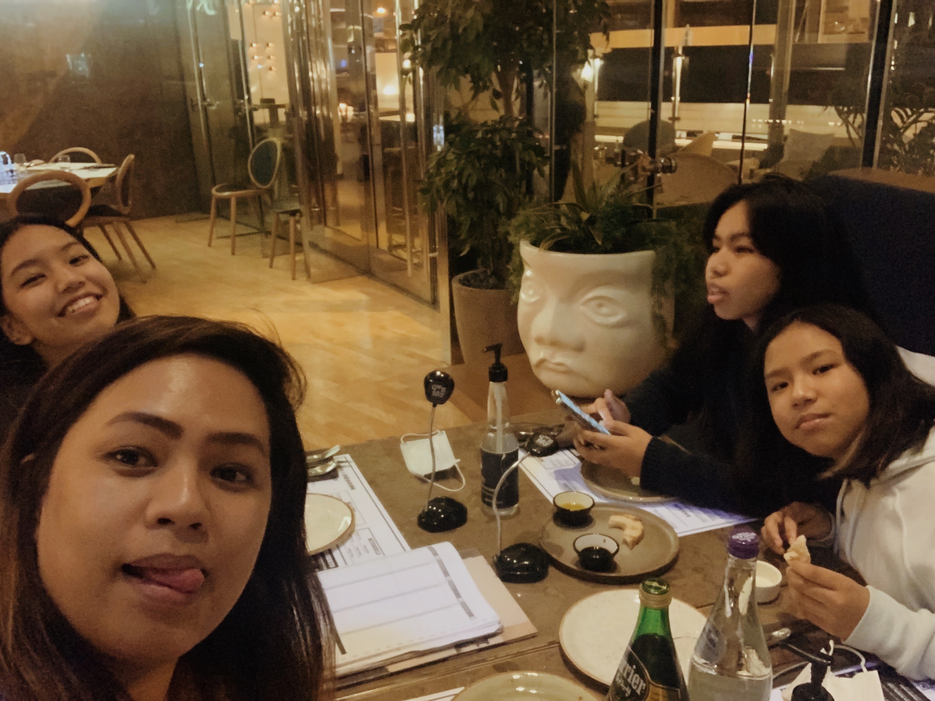 Storefront window display with "mochi" sign and clothing