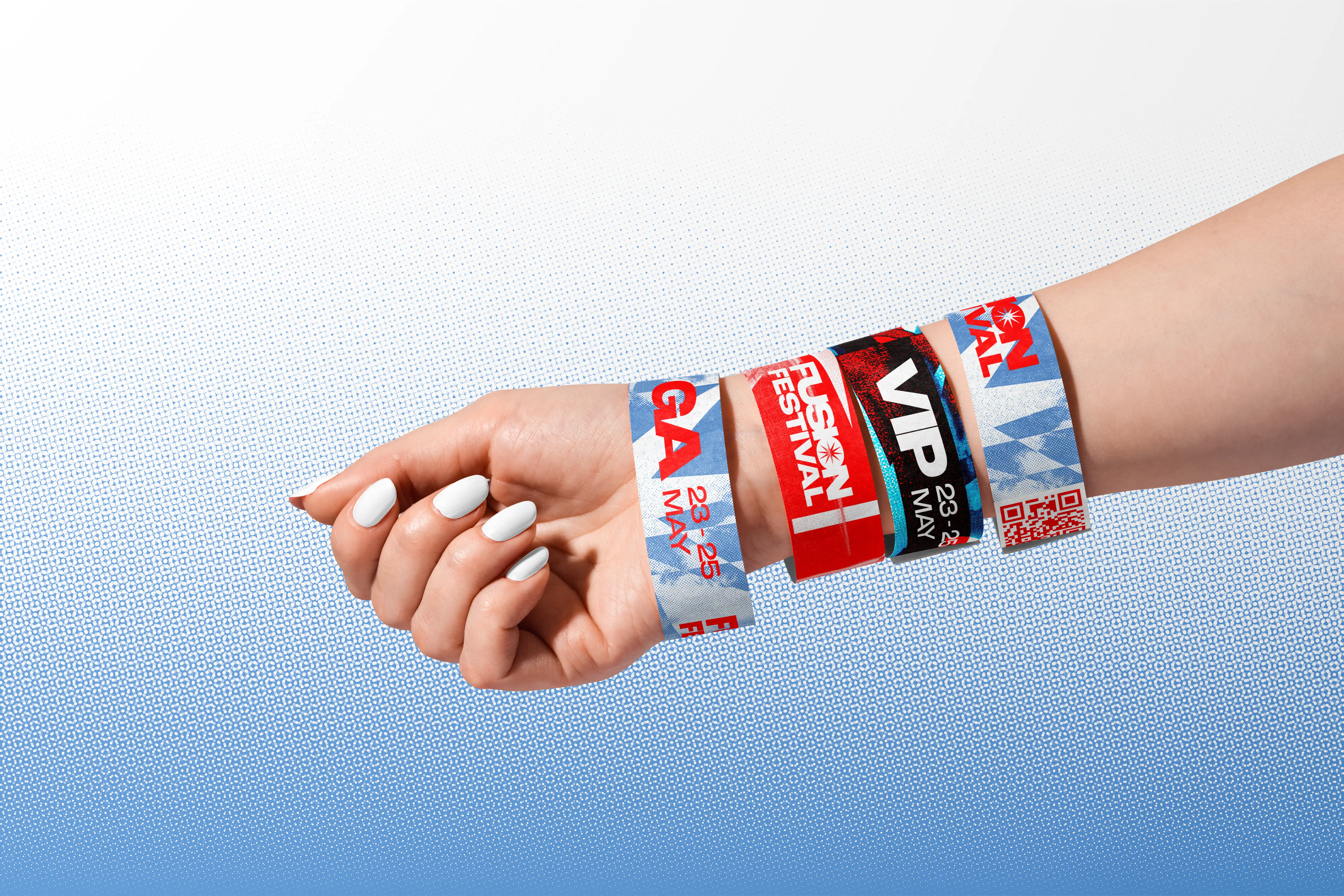 A wrist wearing Fusion Festival wristbands, including a VIP band, against a pale blue gradient