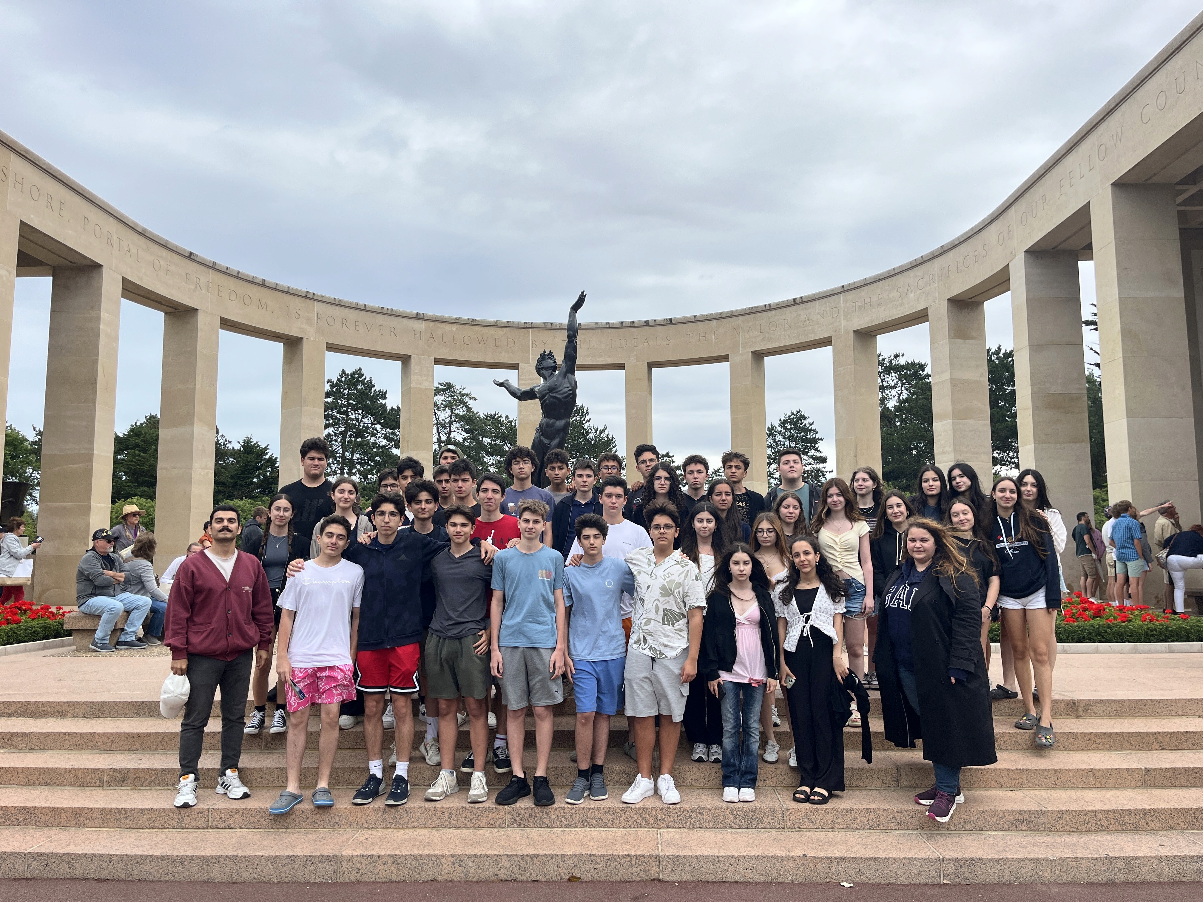 Corner building entrance covered in graffiti and posters.