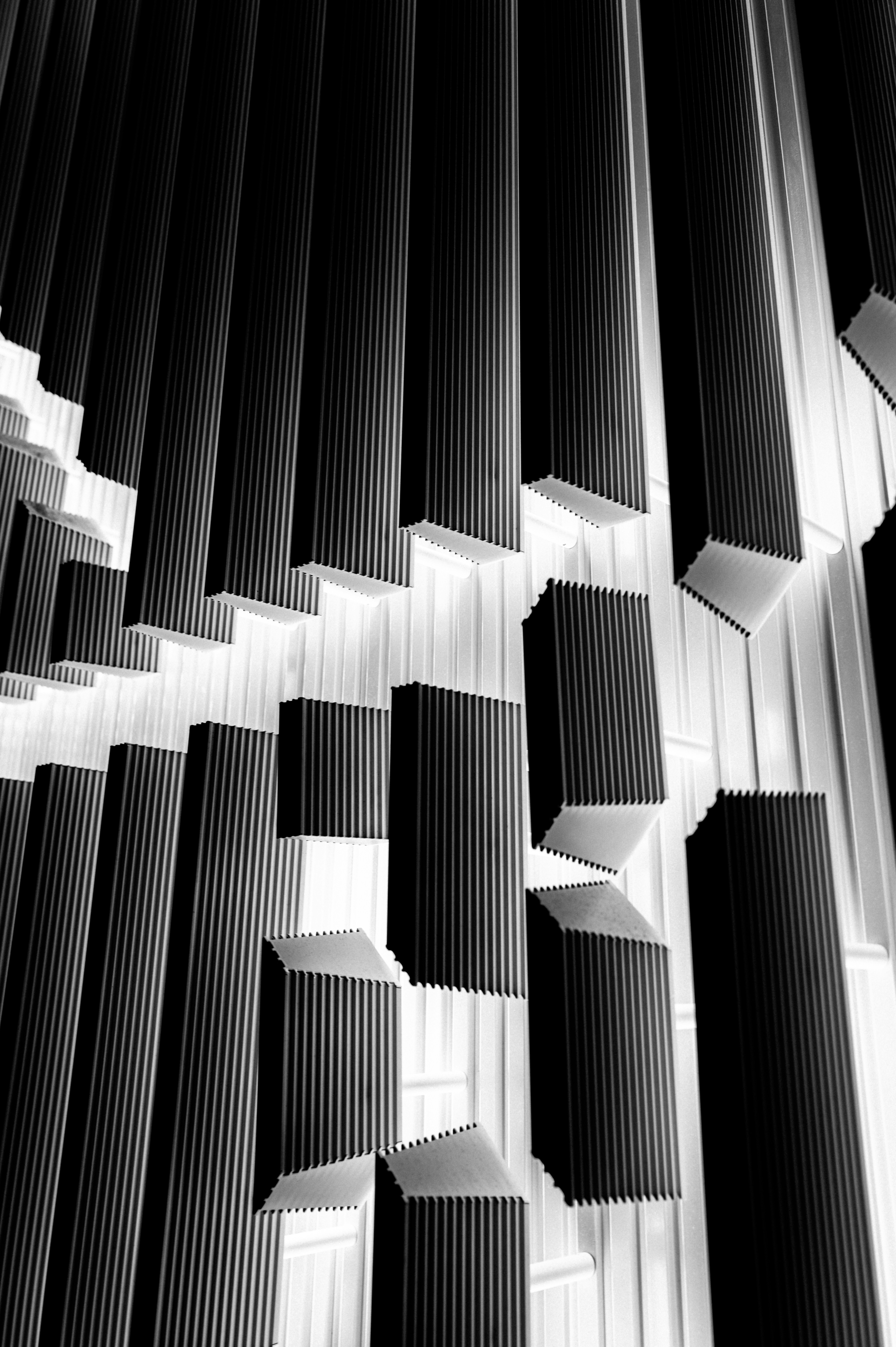 a black and white photo of metal pipes