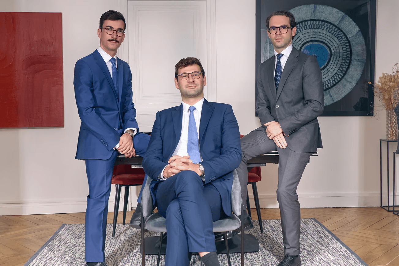 woman sitting around table holding tablet