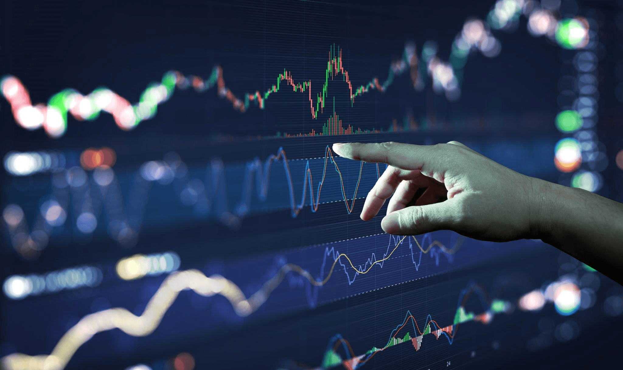 Hands interacting with financial data displays - Best Crypto to Swing Trade
