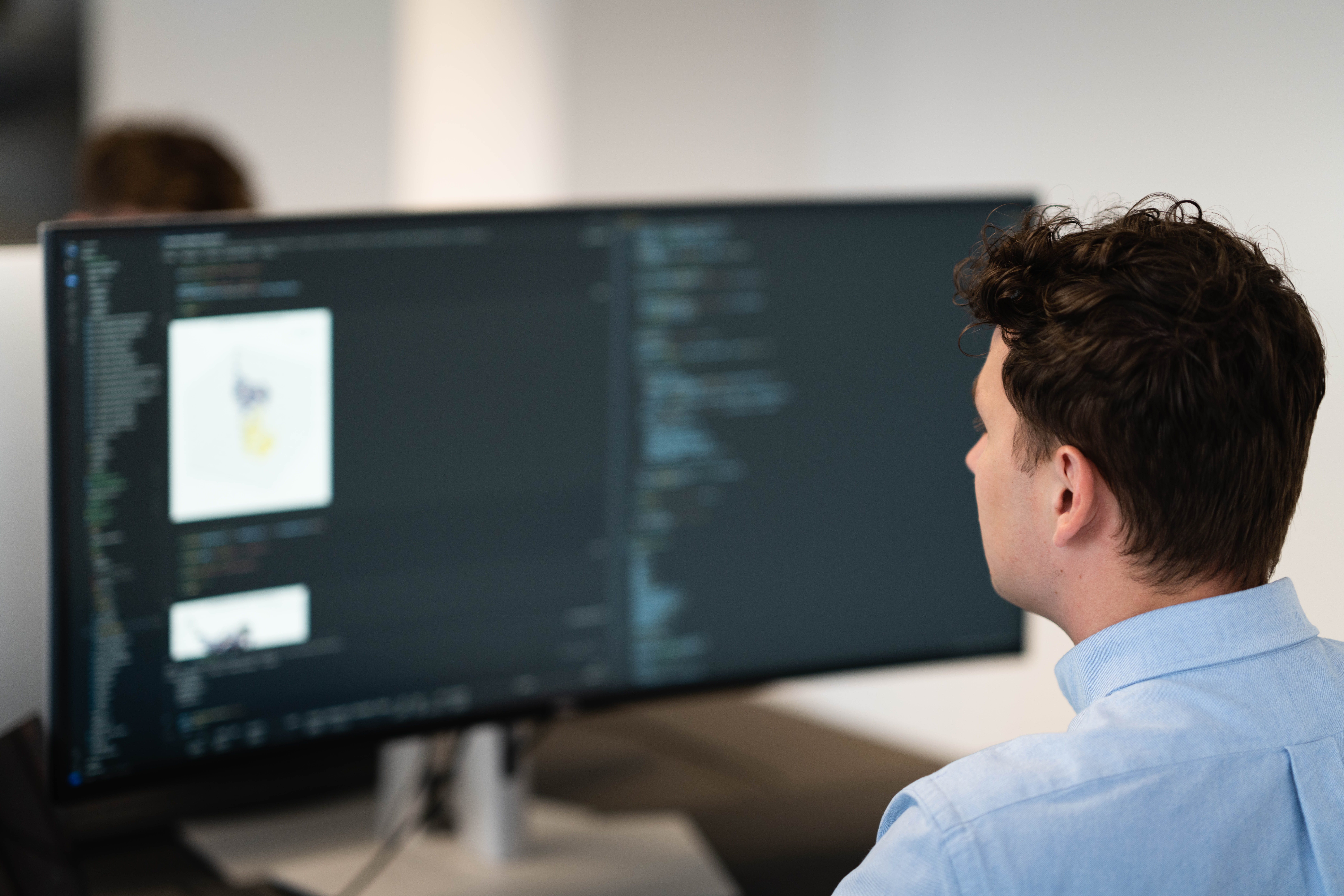 Confident female scientist standing with arms crossed in a cutting-edge laboratory filled with advanced scientific equipment.
