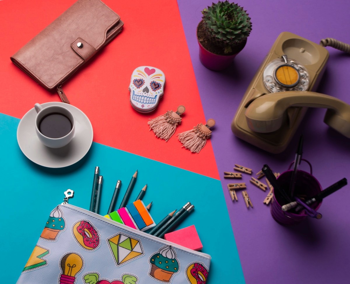 Colourful branded stationery flat lay