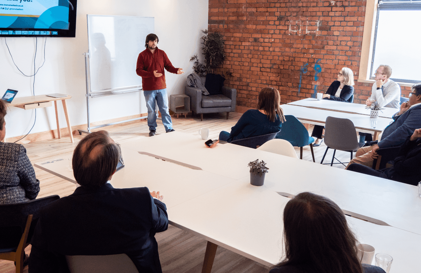 People sitting around a table in an office.