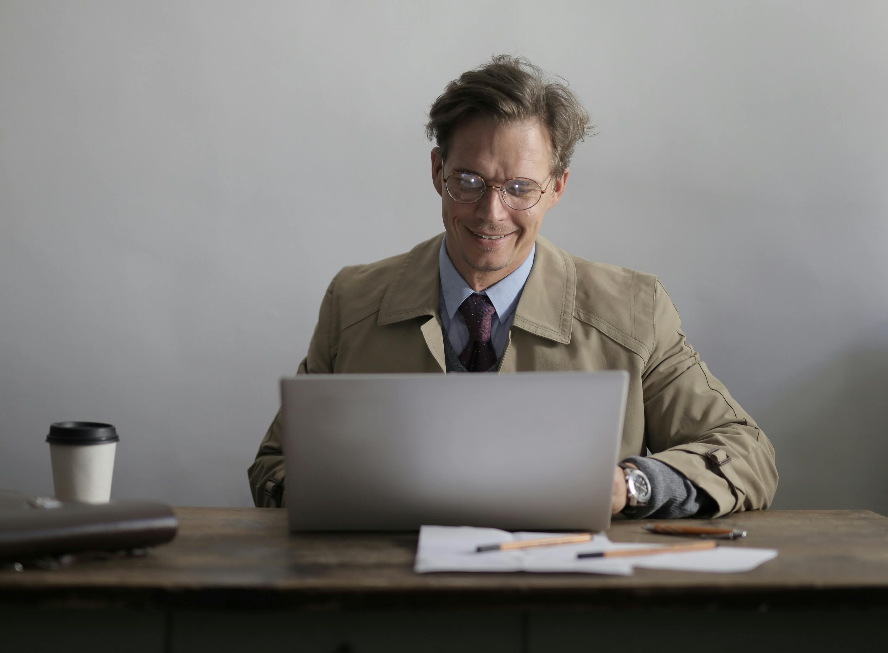 Mortgage broker using laptop in cafeteria