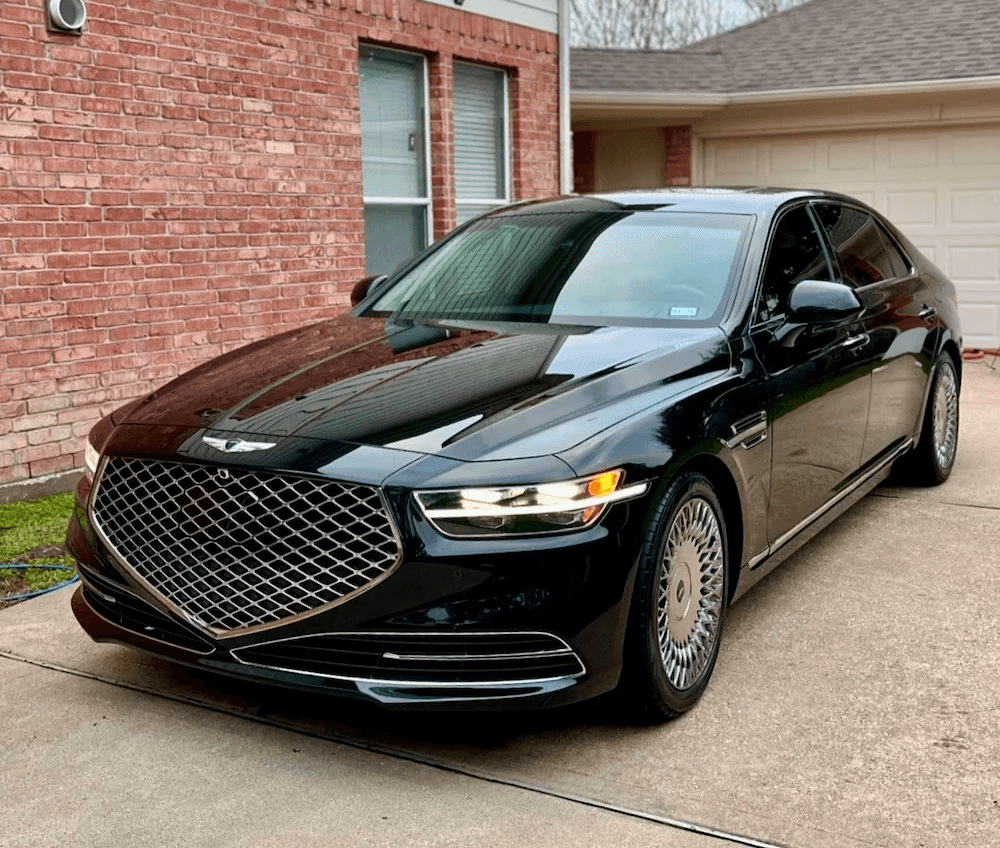 A glossy black luxury sedan after a full exterior car detailing service by Tony Mobile Detailing in Leominster and Worcester.