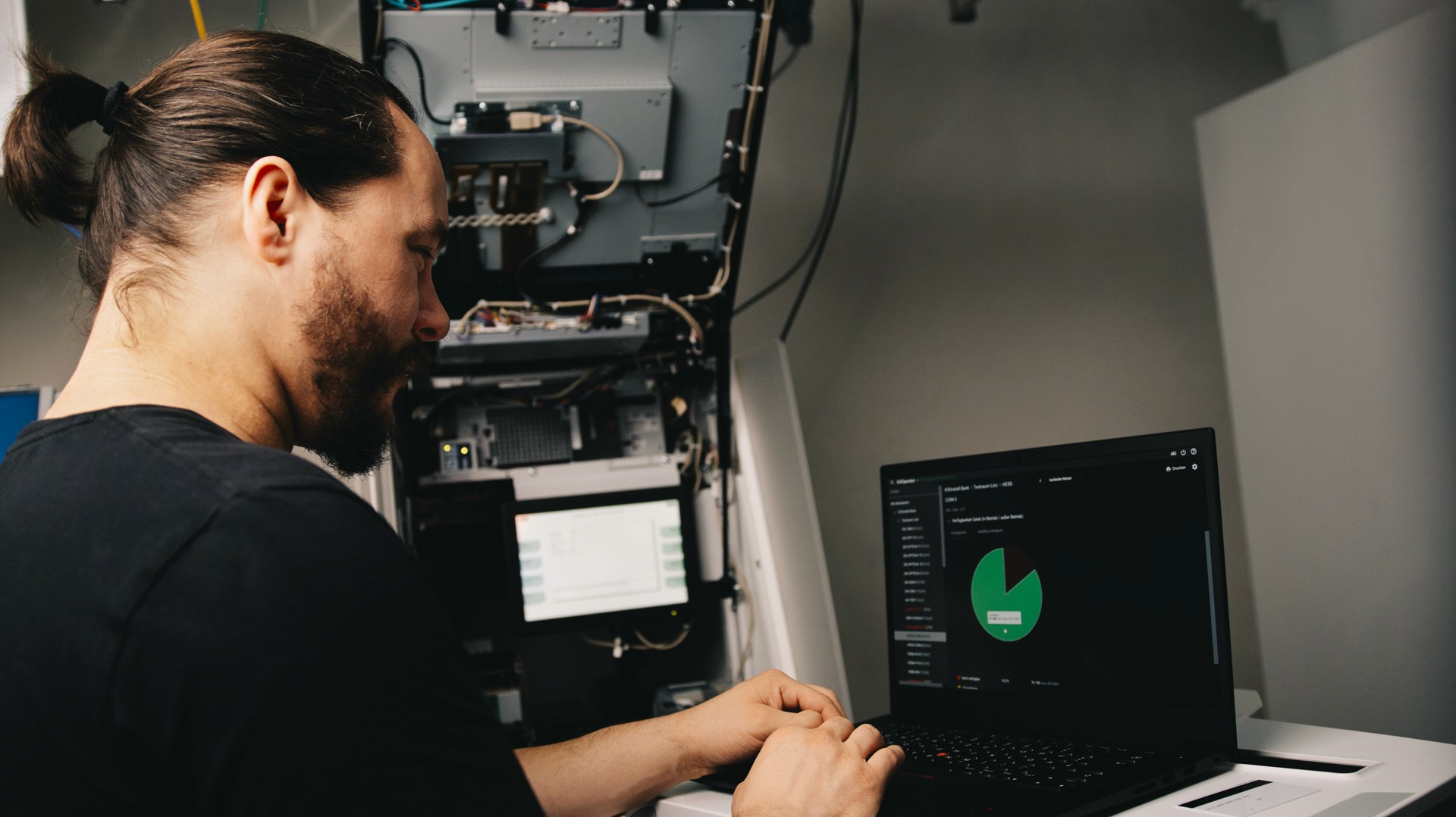 Advanced ATM machine with a technician using predictive maintenance software on a tablet, showing real-time diagnostics in a high-tech bank environment