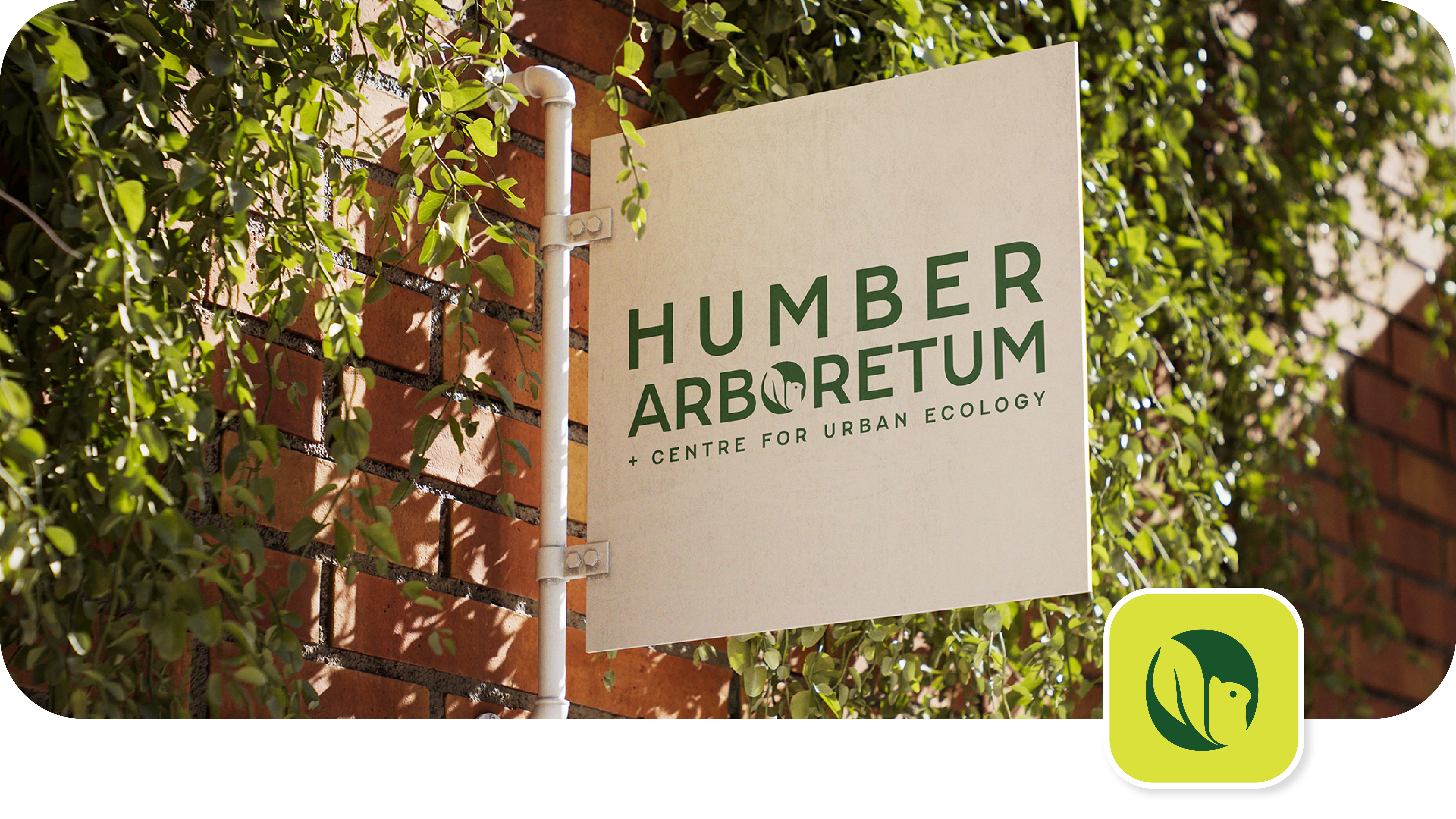 Humber Arboretum + Centre for Urban Ecology sign on a brick wall with vines.