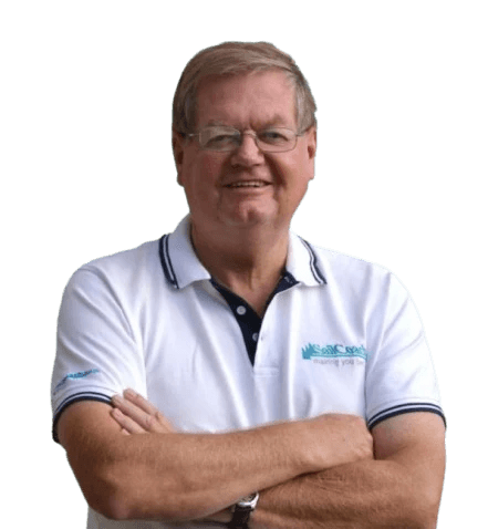 A man standing with Sufboard