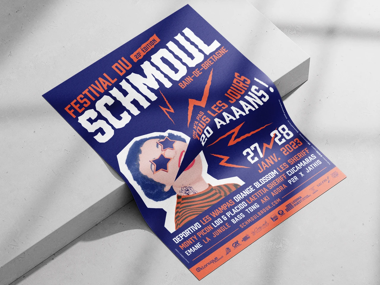 Affiche de l'édition 2023 du Festival du Schmoul posée au sol