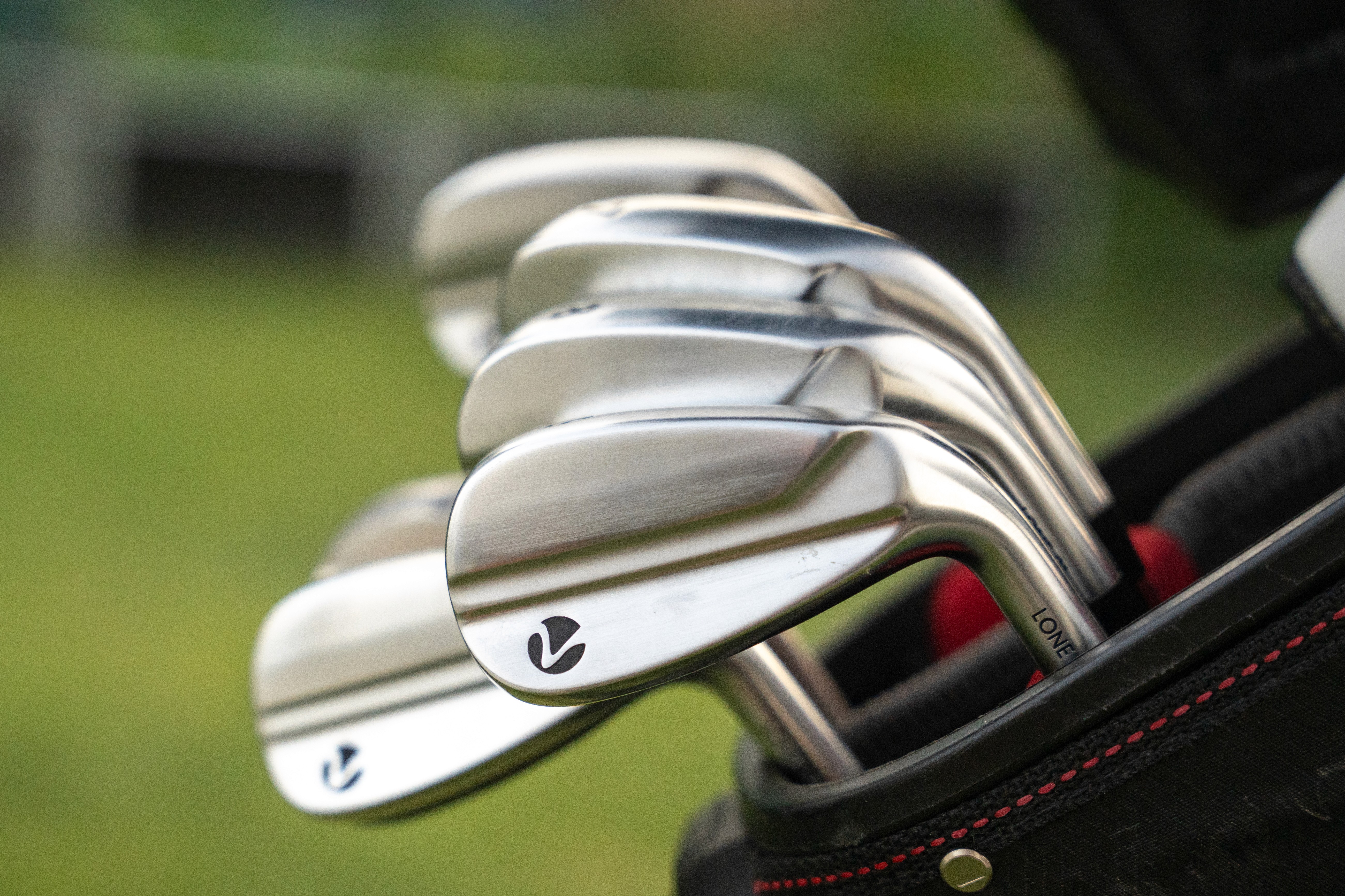 kids lying on a glass land and smiling