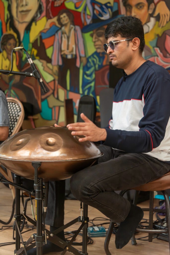 Sagar Belsare performing handpan during a corporate wellness and immersive sound session in Pune