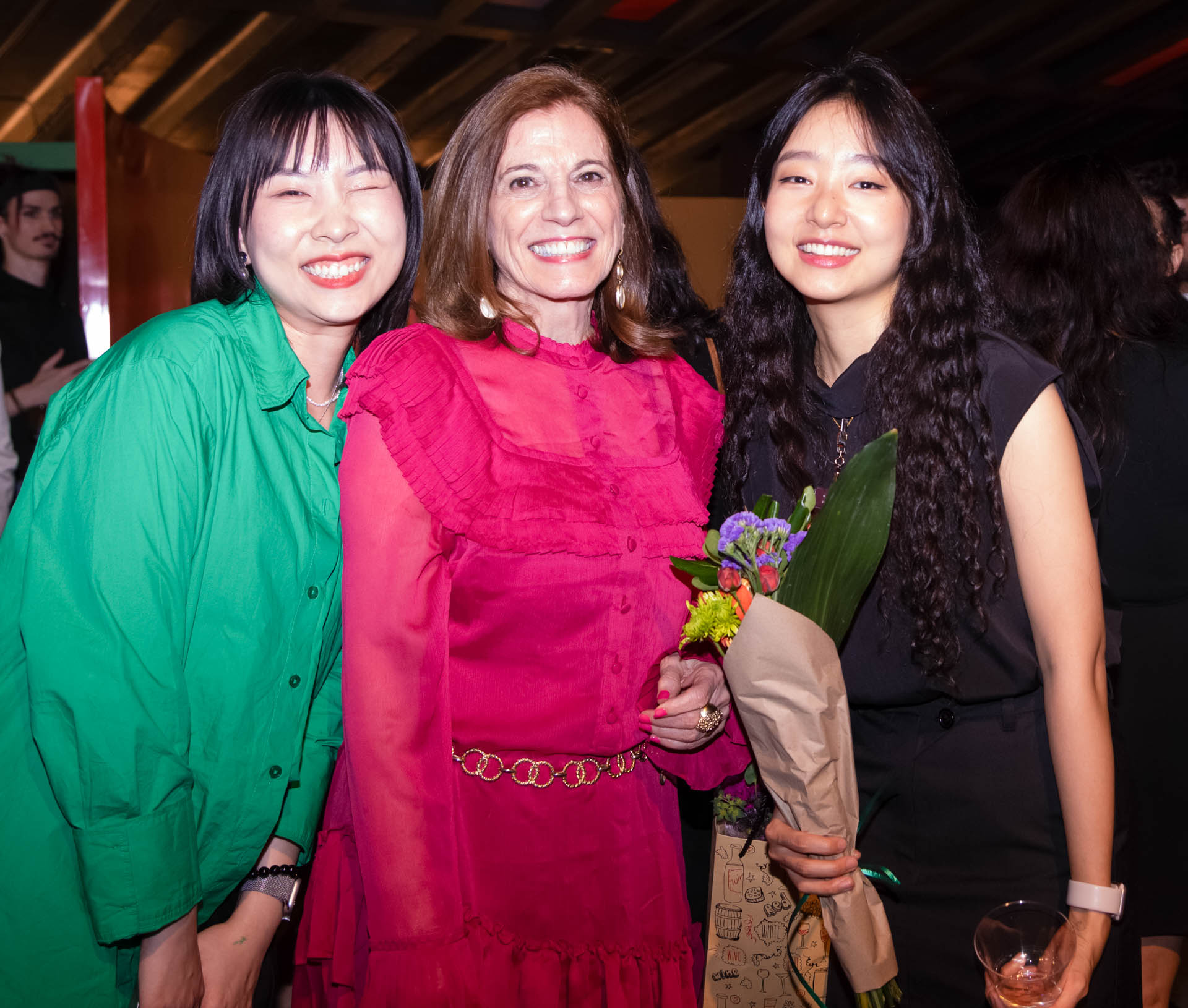 a group of students smiling for the camera in the SVA Theatre lobby after the Venture Forum