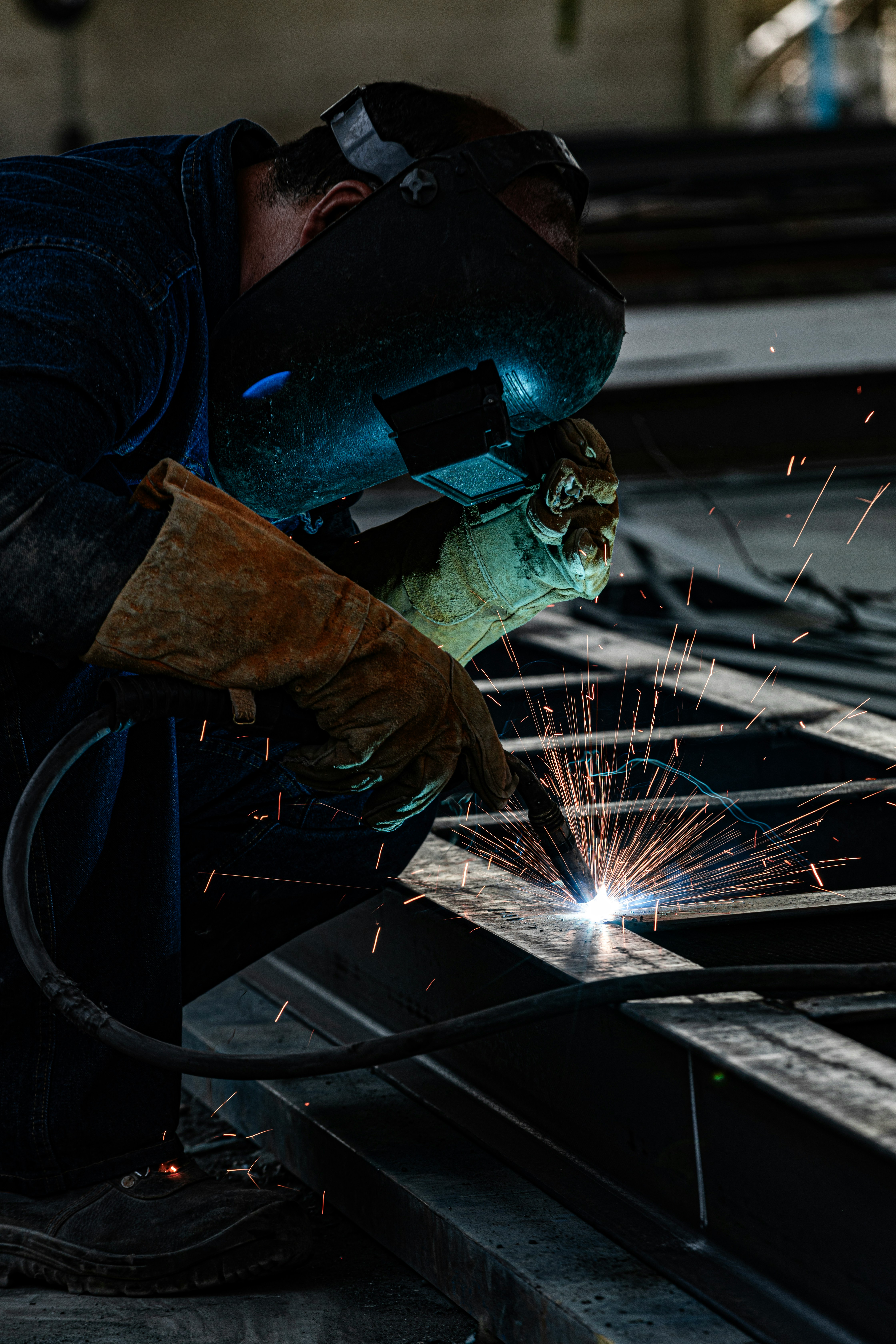 a welder working on a piece of metal