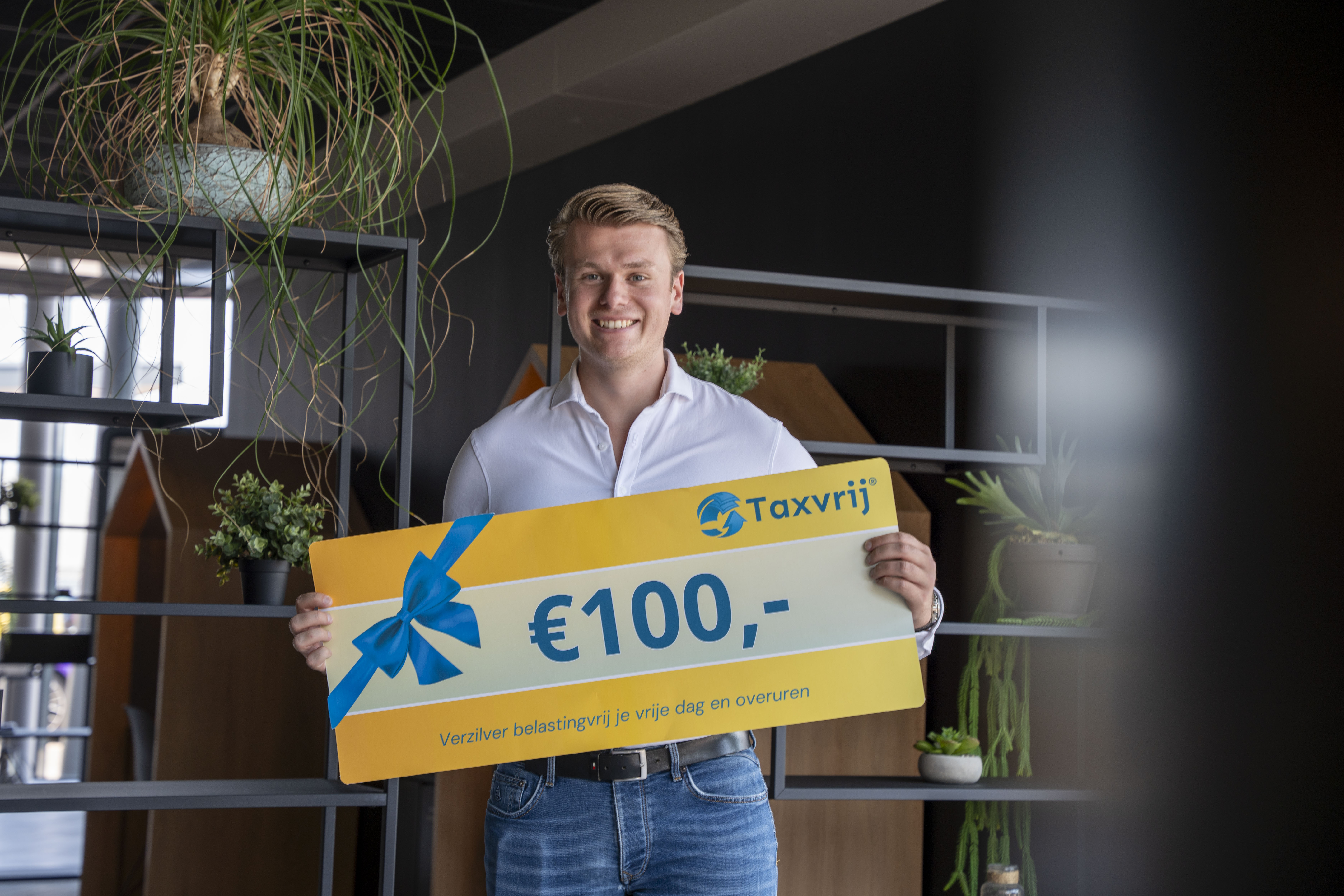 a person standing on a beach next to a body of water