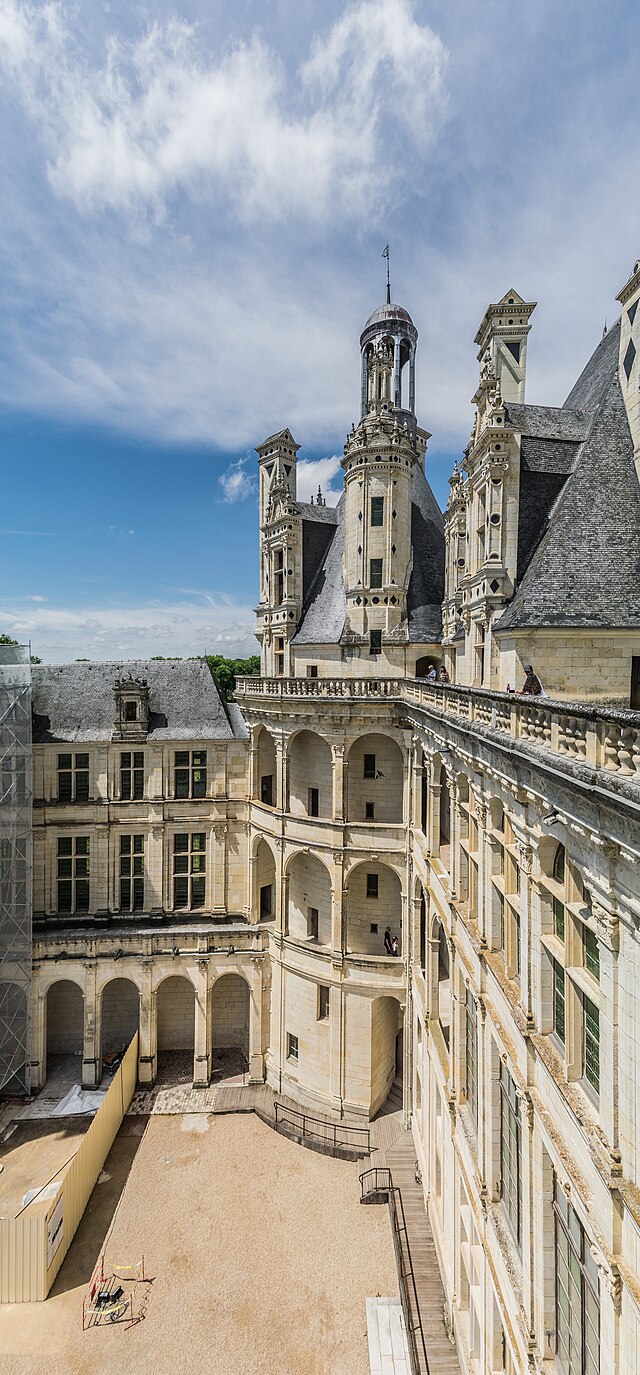 photo of house near cliff and body of water