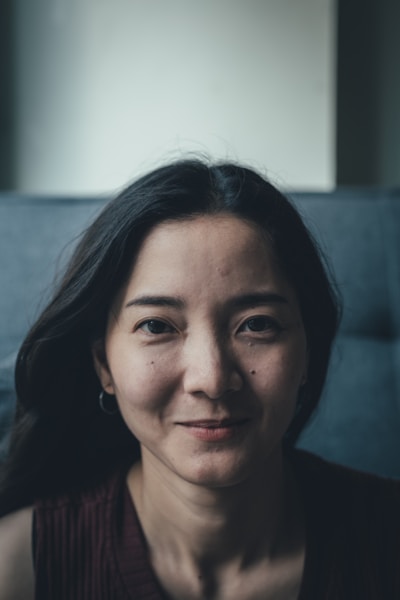 A woman with dark hair looking toward the camera.