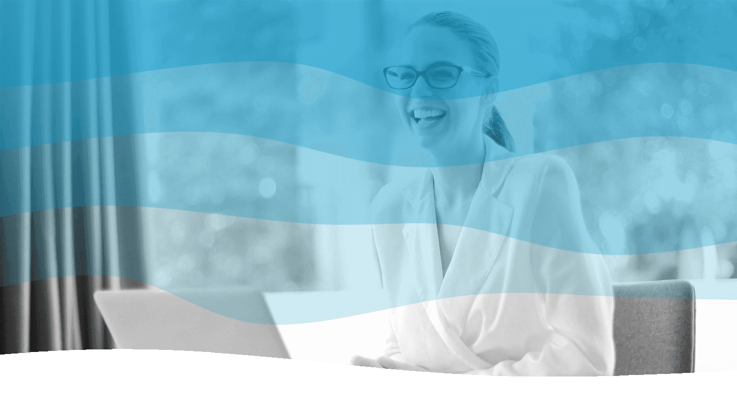 In a serene, well-lit office environment, a person in a professional suit is smiling and working at a laptop, with a filtered blue overlay enhancing the image's modern aesthetic.