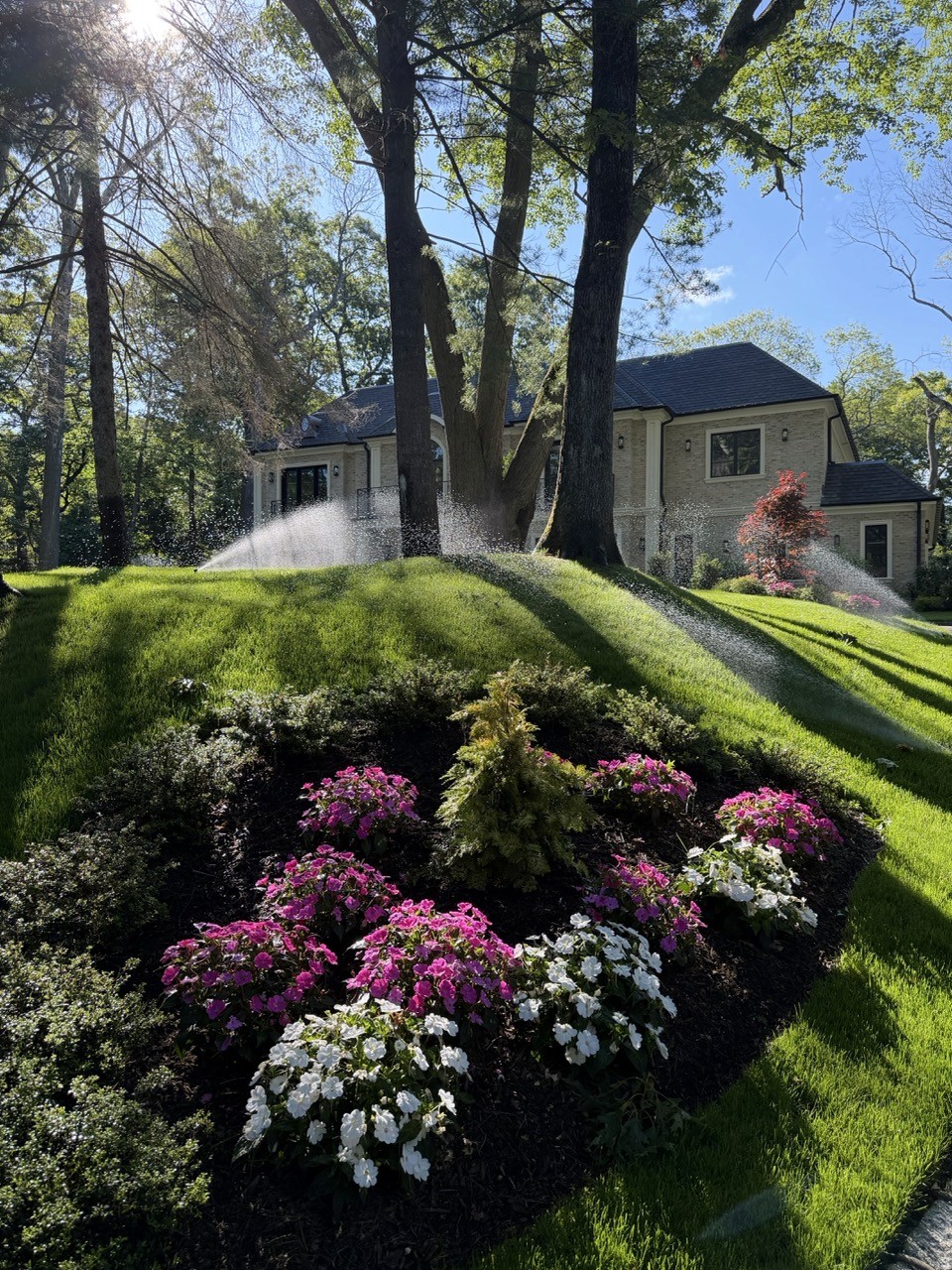 Irrigation sprinklers watering a flower bed by Bonilla Irrigation & Contracting, Long Island NY