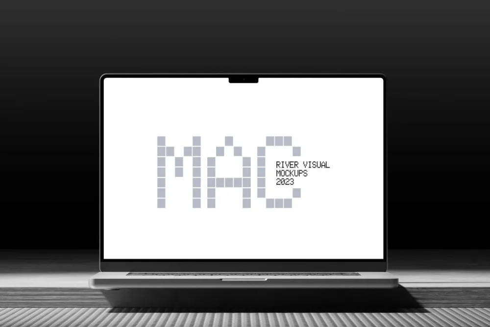 A MacBook displayed front-facing on a sleek, textured surface with a dark gradient background. The screen features a clean, minimalist design, emphasizing the laptop's thin bezels and compact camera notch.