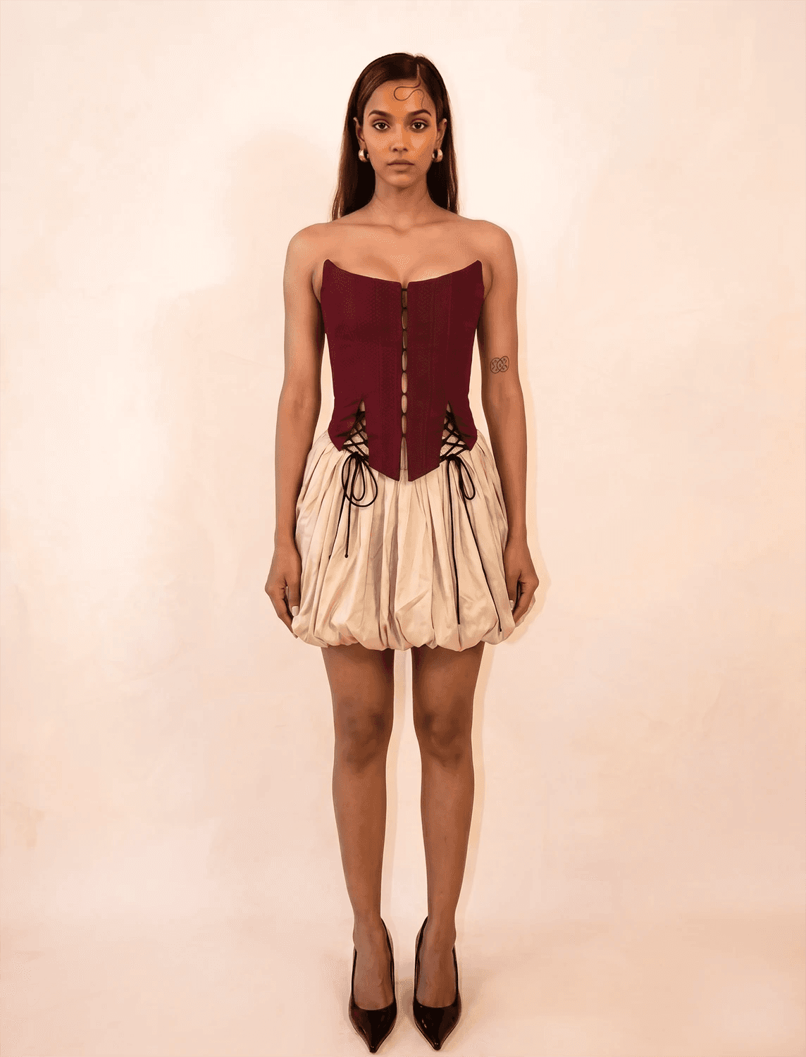 four-panel corset crafted from a vintage Maroon silk sari, featuring V-cut detailing and adjustable lace-up panels, consciously handcrafted by Bodements to celebrate heritage, craft, and mindful fashion.