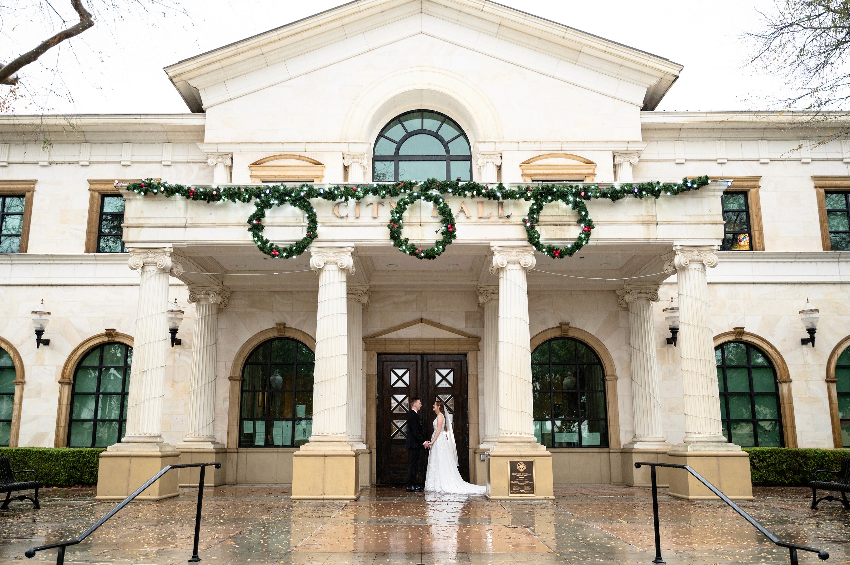 Flat lay wedding details with bouquet, rings, and sparkling bridal heels