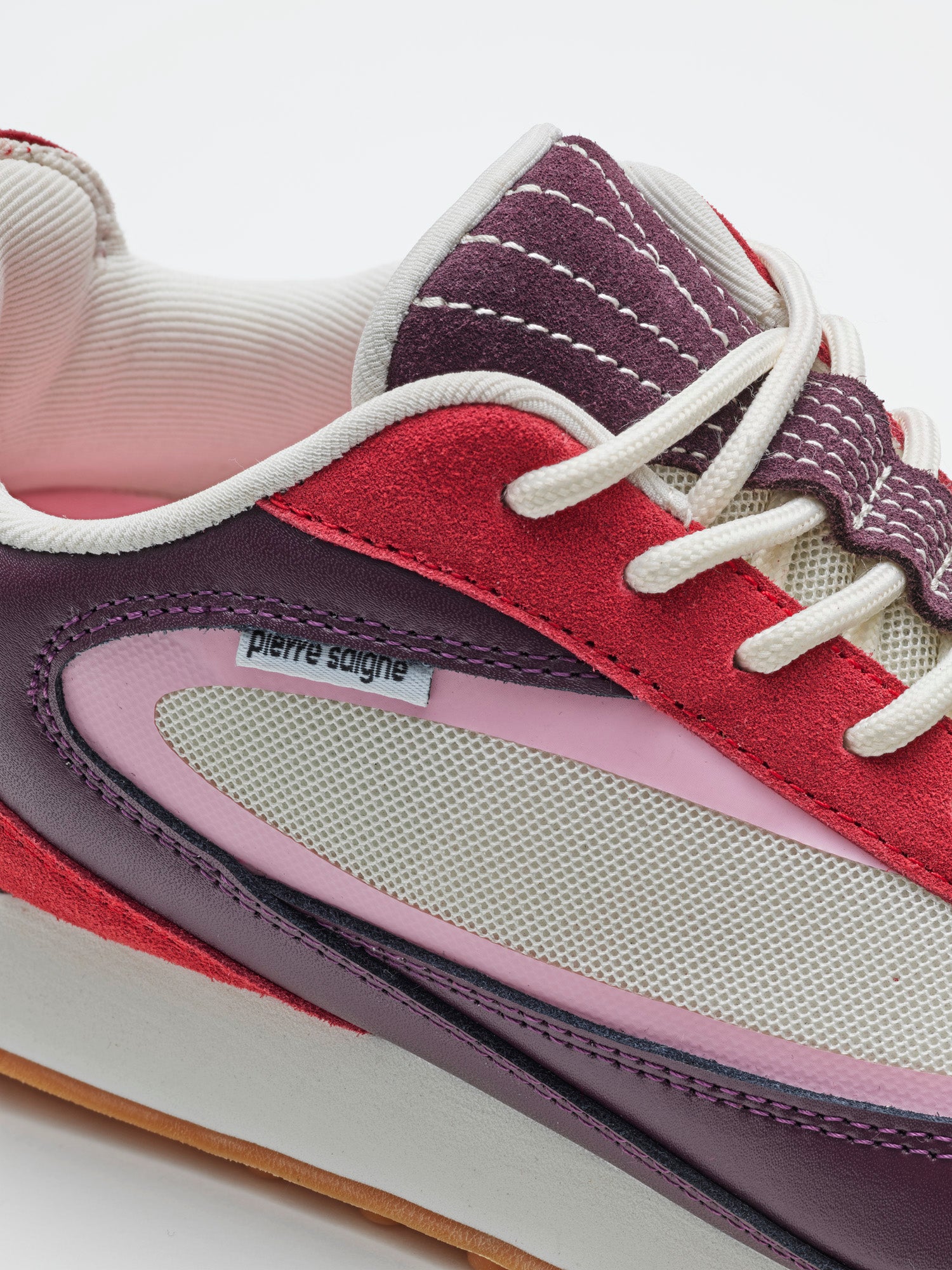 pierre saigne ps_001 sneakers in colorway bacon, burgundy, red, pink and white, close-up material detail texture and color,  pierre saigne logo 