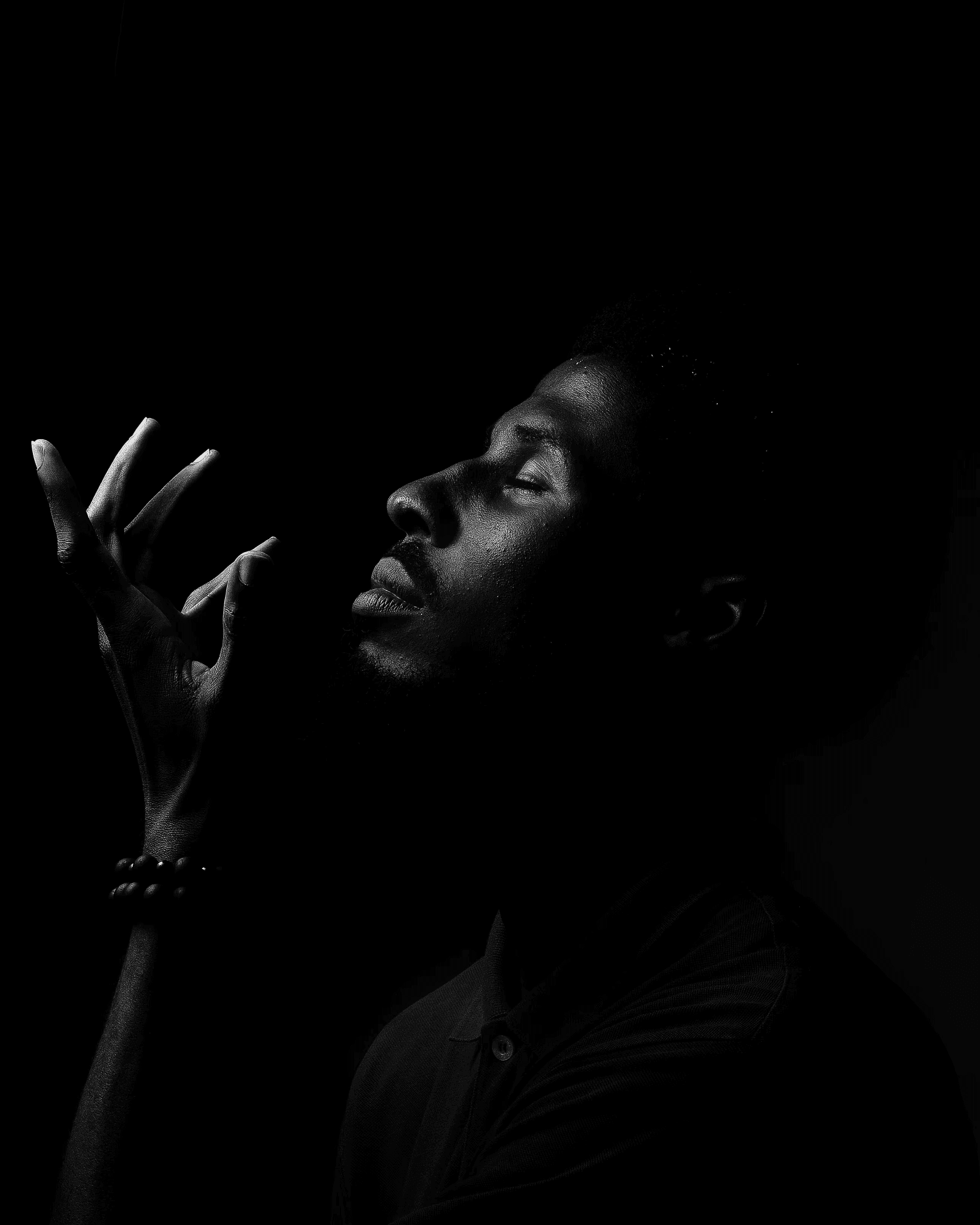 A man pausing side ways while meditating