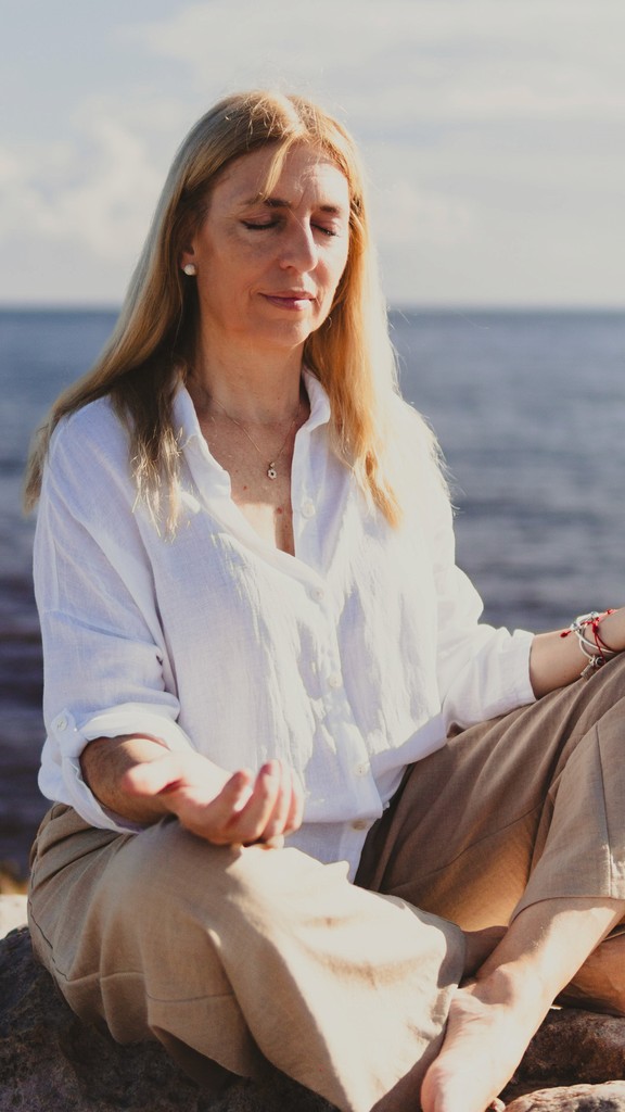 Two people stretching on yoga mats