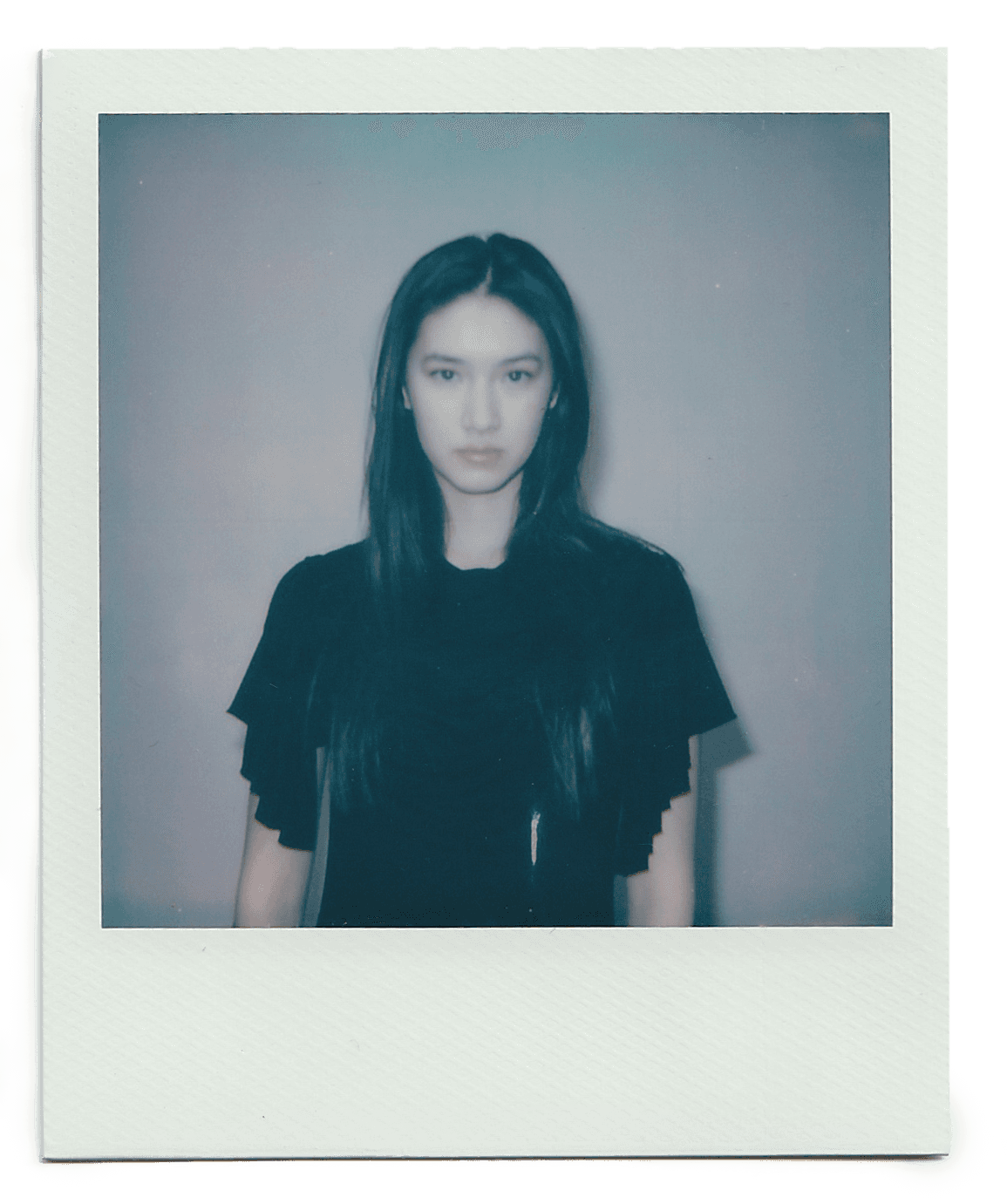 American flag flying against a cloudy sky