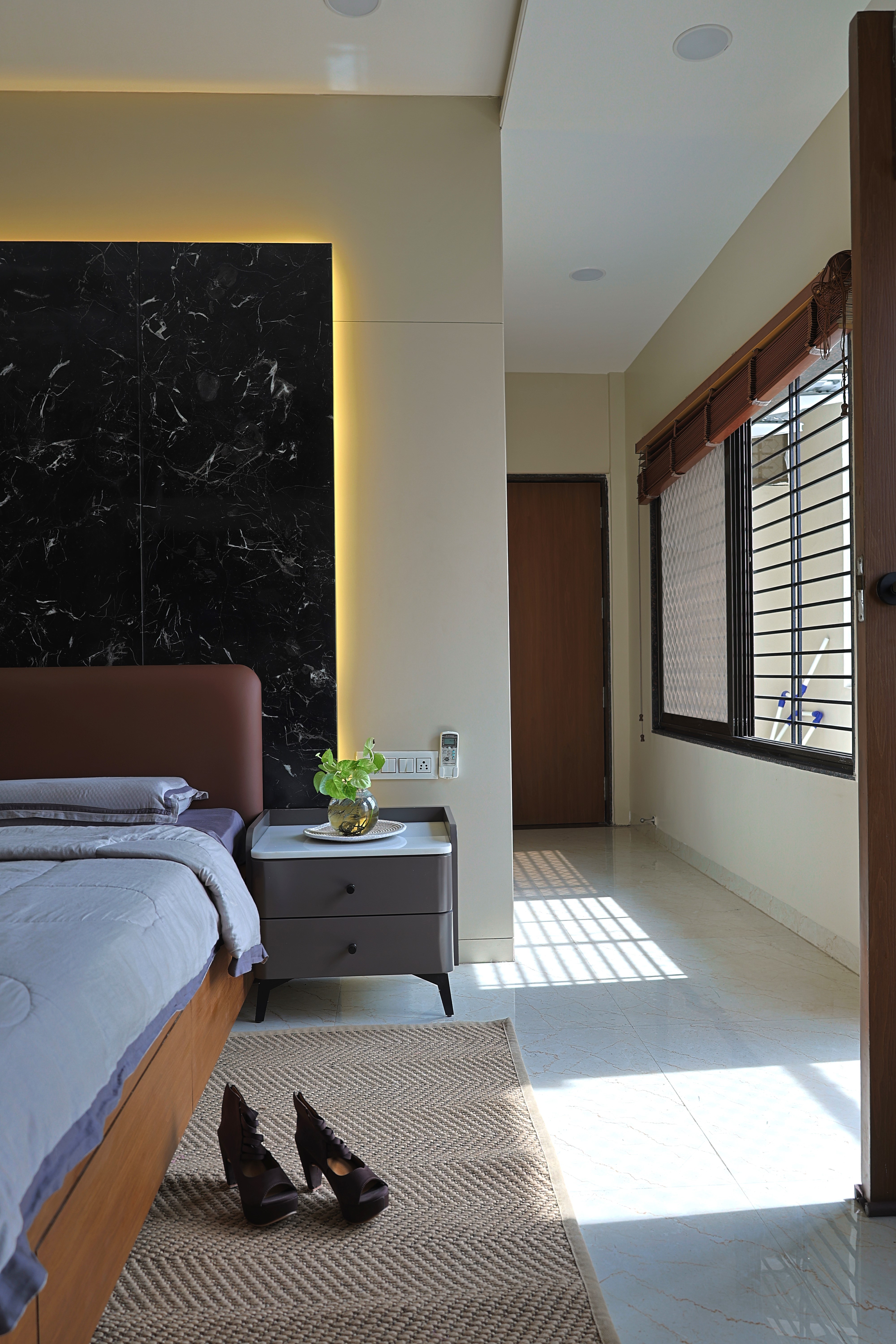 a living room filled with furniture and a large window