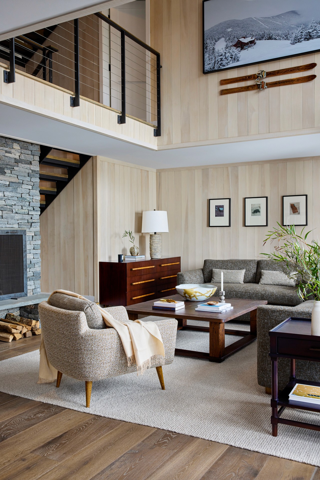Minimalist hotel room with floor-to-ceiling mountain view windows
