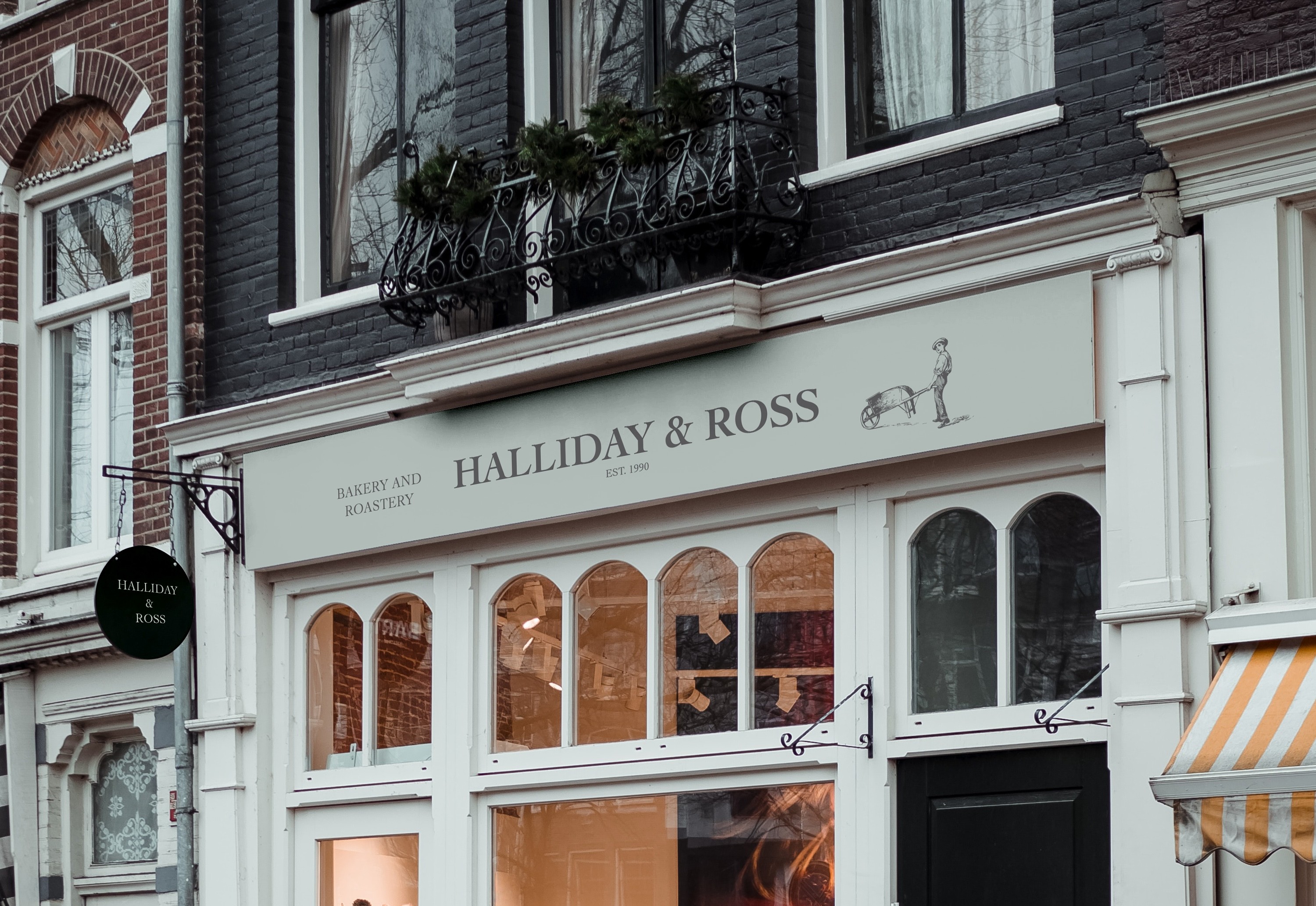 Halliday and Ross Bakery and Roastery cafe signage with text and logo design, including boy pushing wheelbarrow