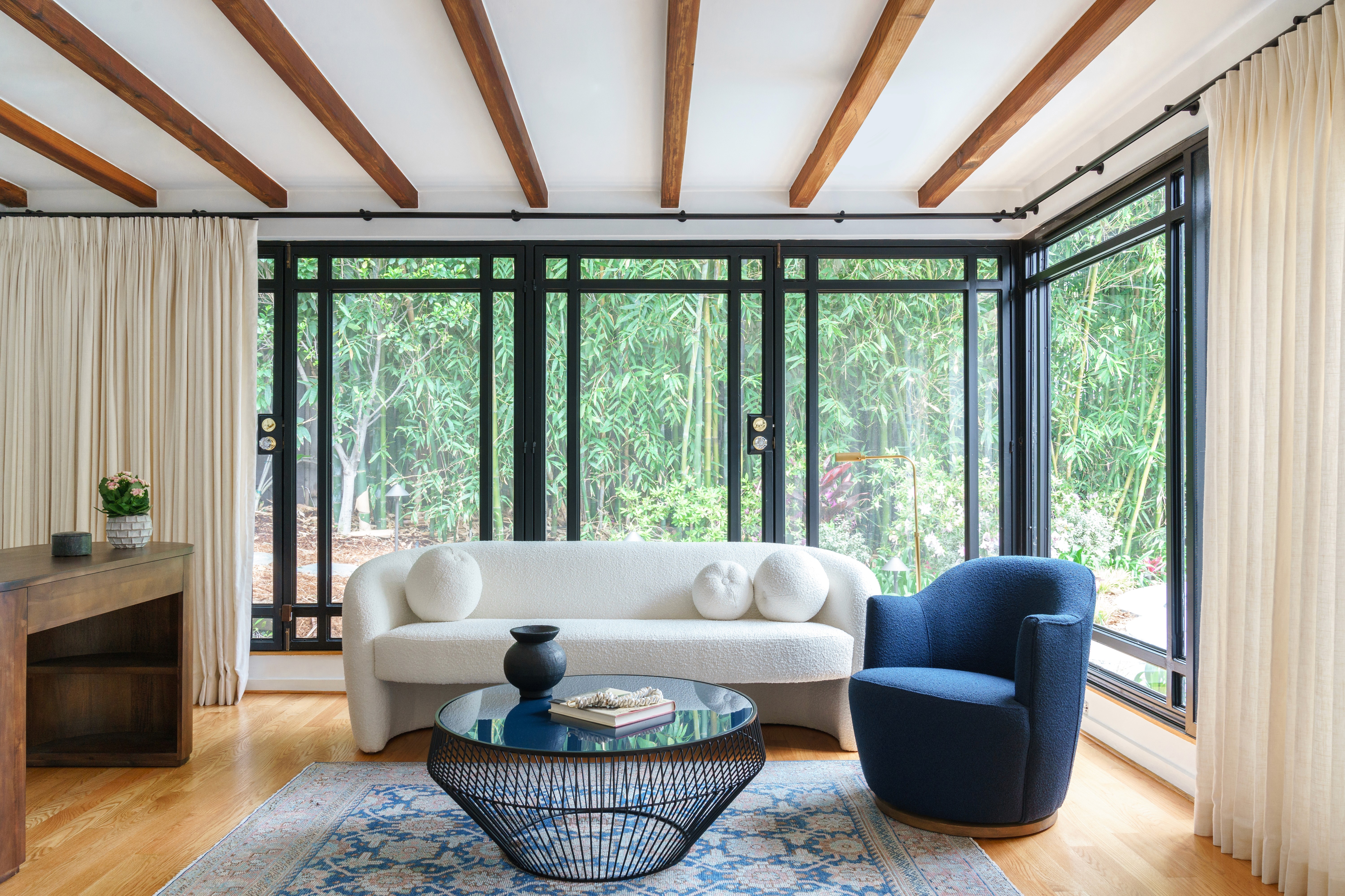 A Modern and inviting contemporary living room design featuring warm earth tones and natural textures