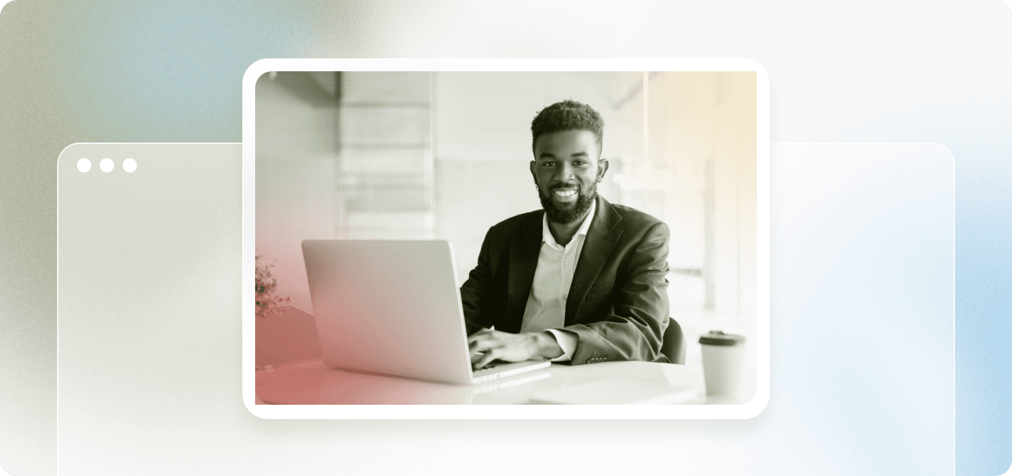 man on a laptop smiling
