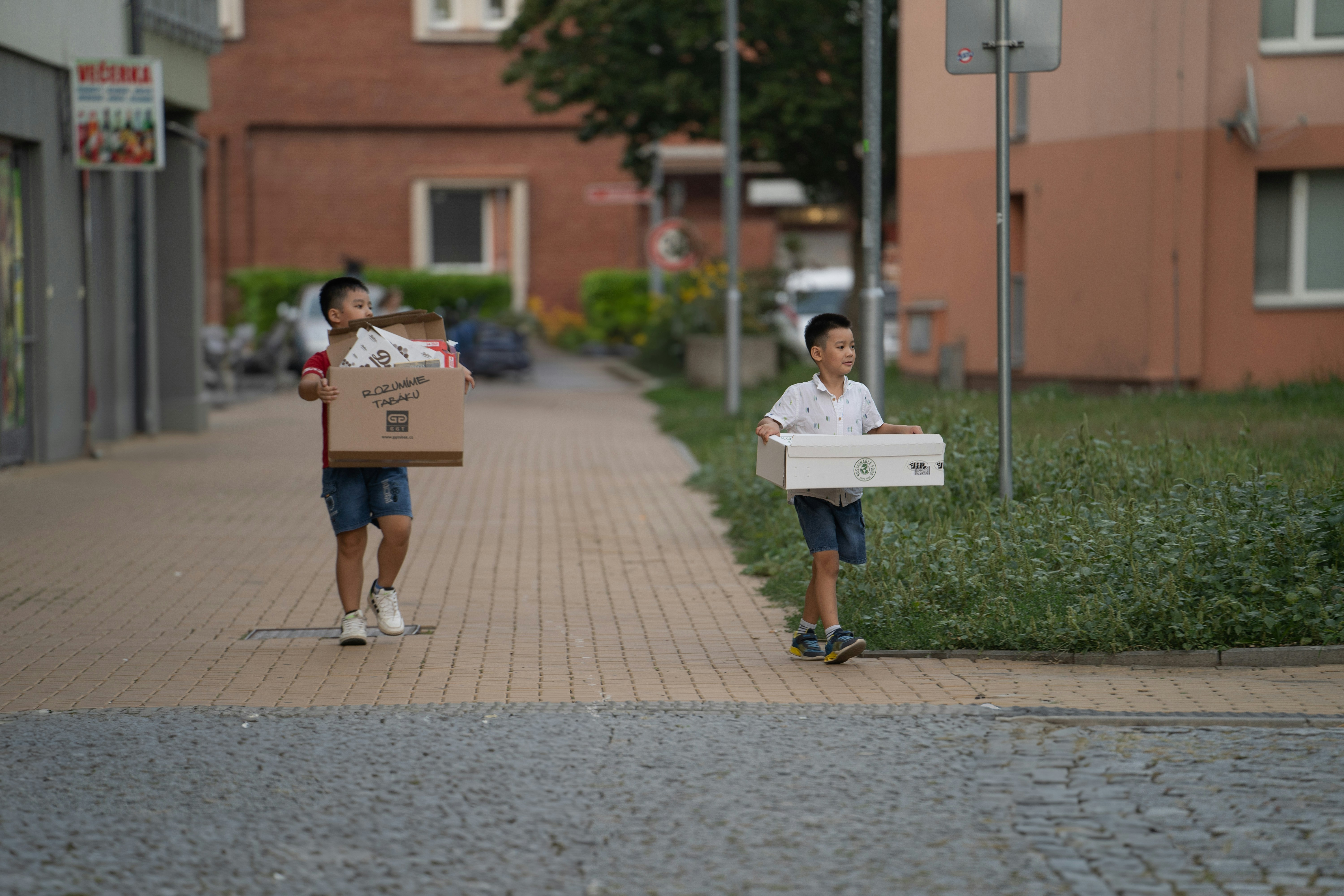 A couple of people walking down a street