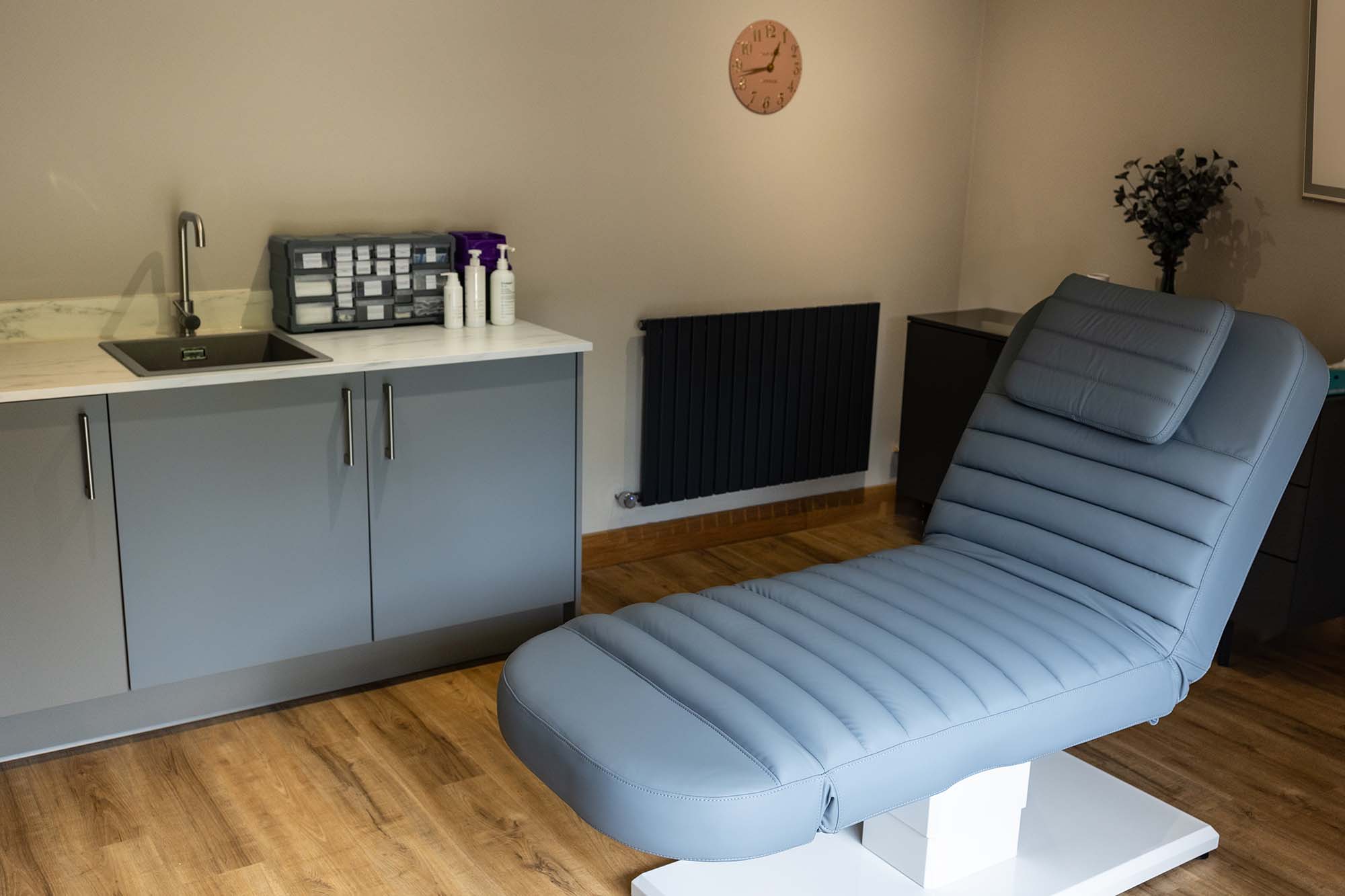 treatment room with grey bed