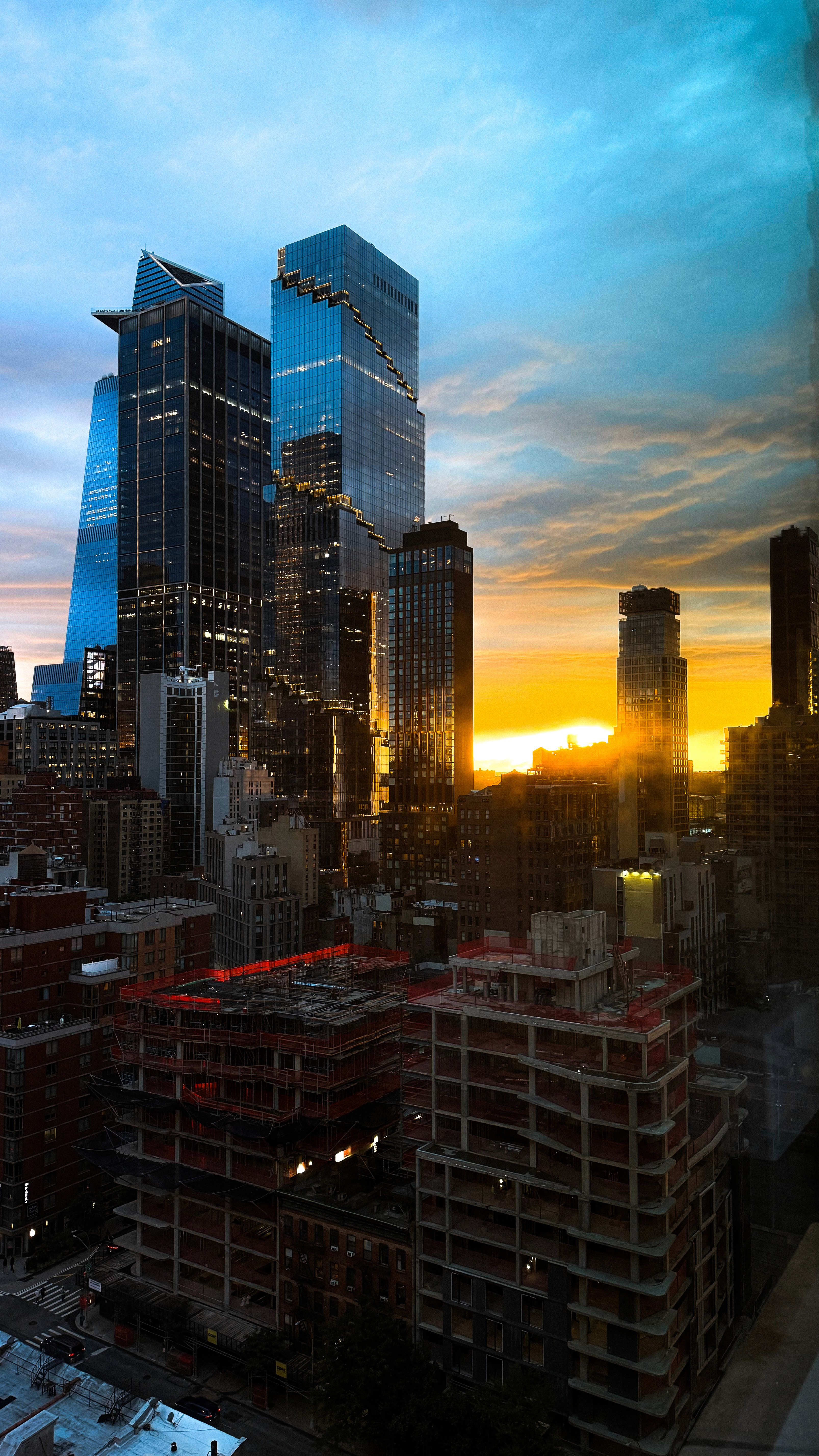 Dancer in black outfit with one leg raised behind
