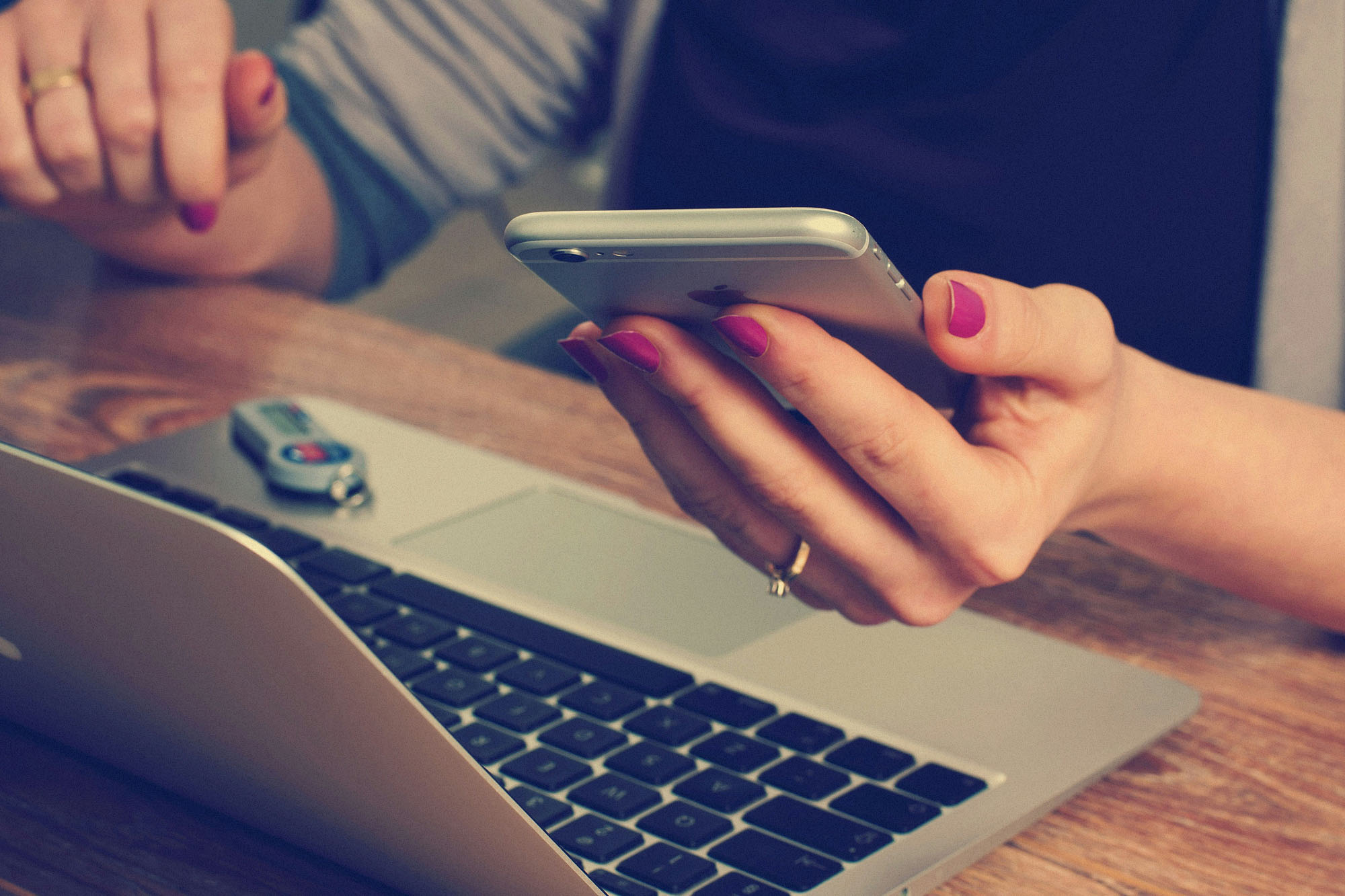 woman holding a cell phone.