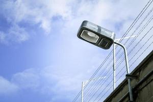 Outdoor security lighting illuminating a driveway.