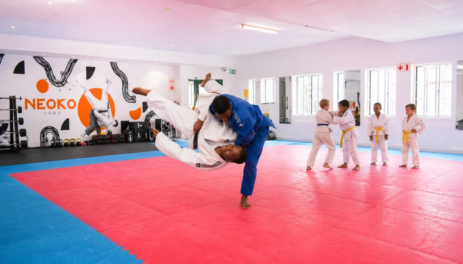 Judo throw demonstration on the mats at NeoKo Judo, Bryanston.